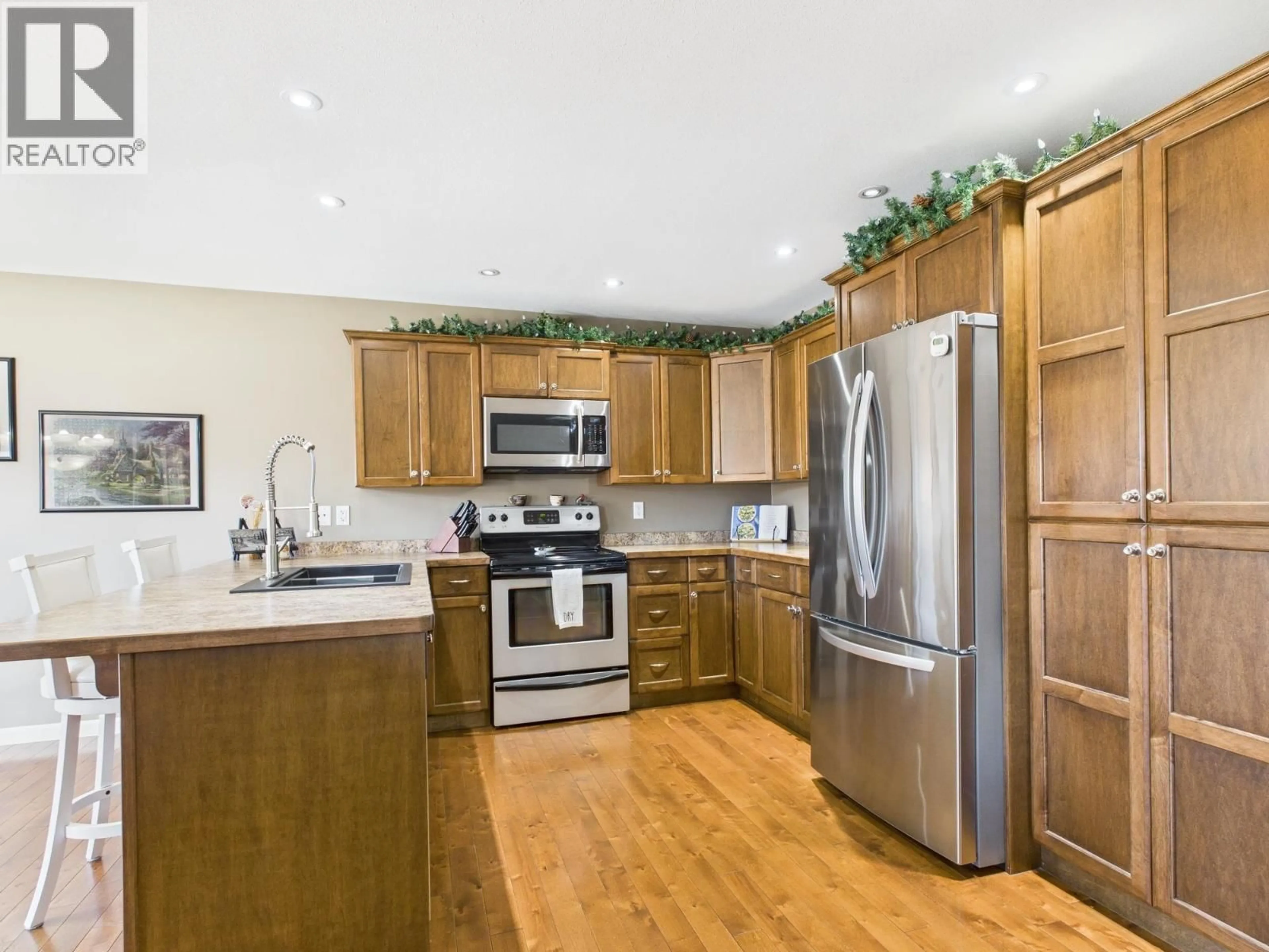 Open concept kitchen, wood/laminate floor for 959 MIDNIGHT DRIVE, Williams Lake British Columbia V2G5K6