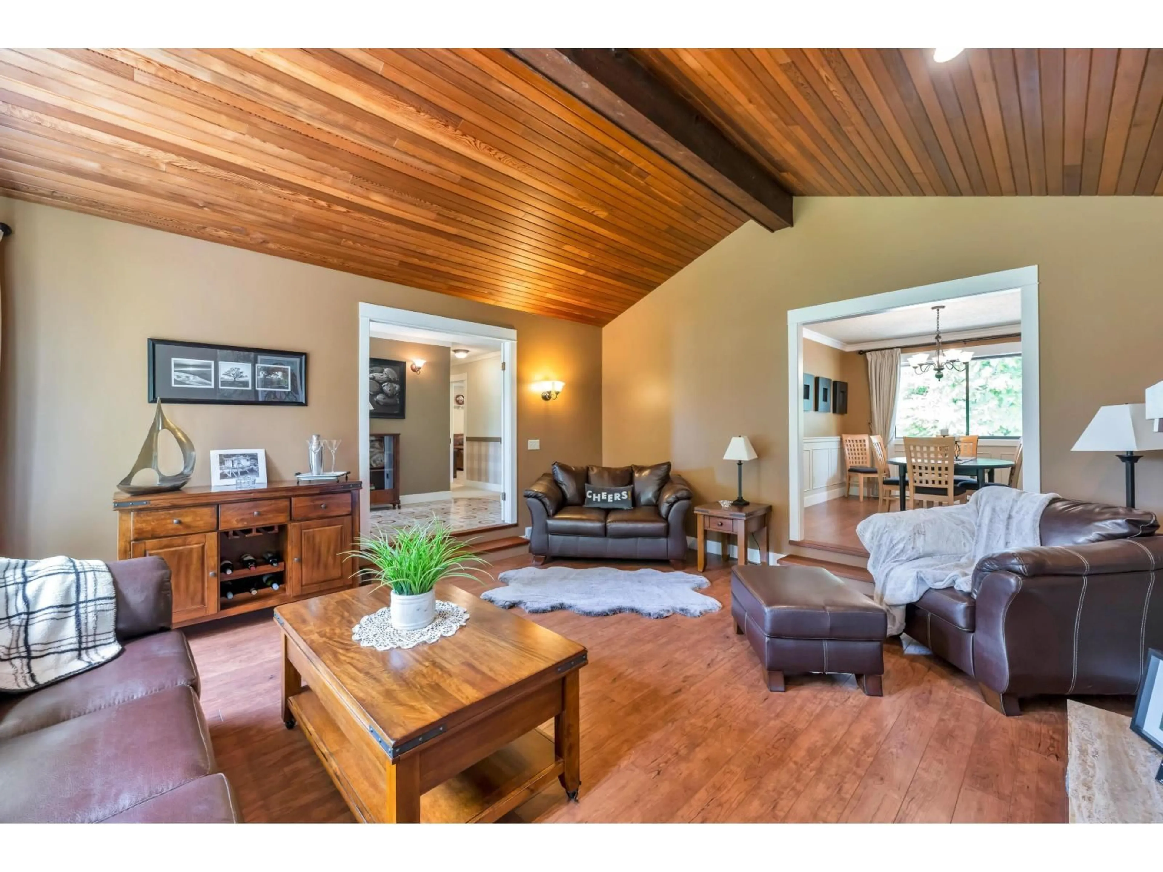 Living room with furniture, wood/laminate floor for 21761 49A, Langley British Columbia V3A6C4