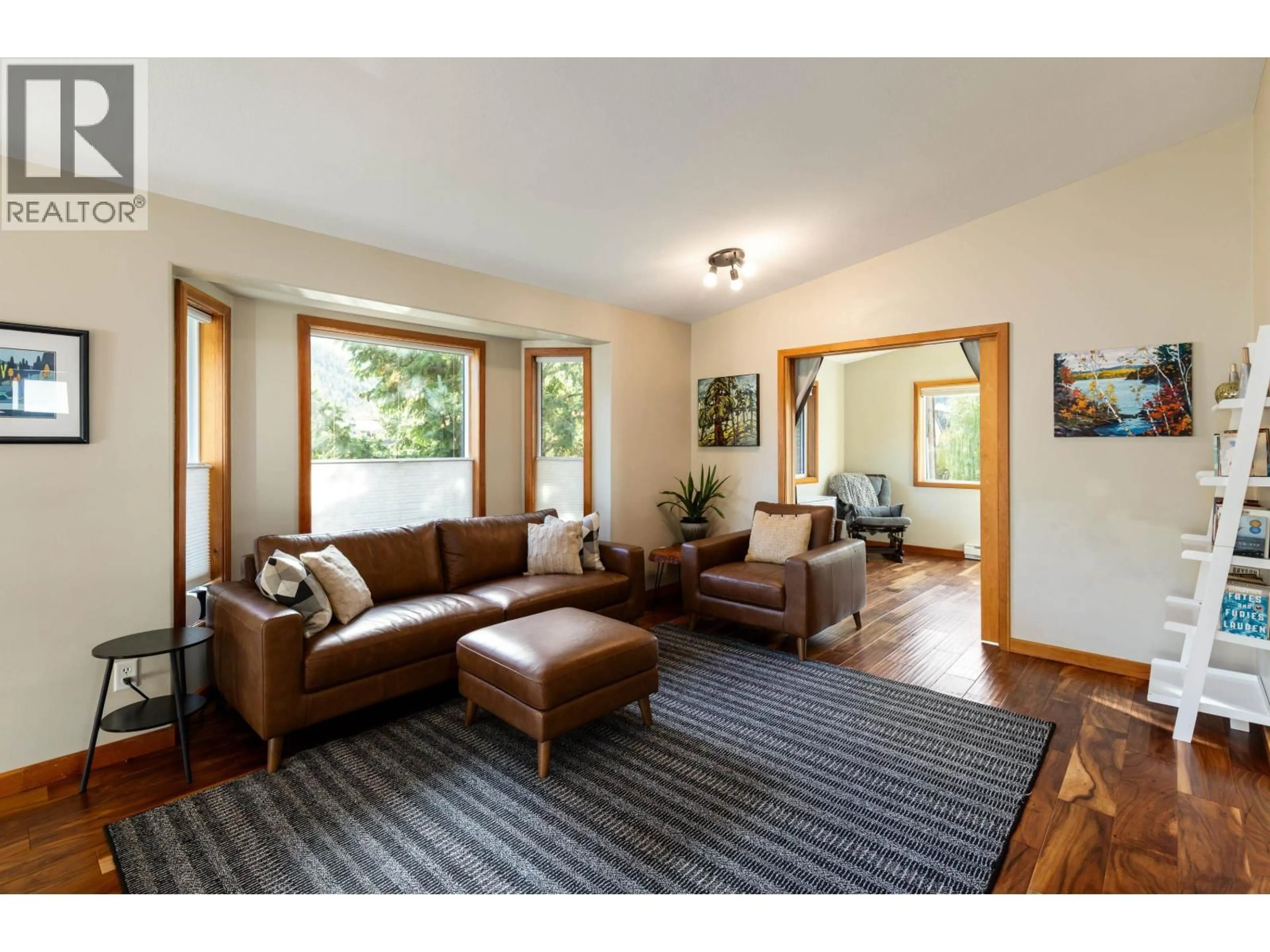 Living room with furniture, wood/laminate floor for 7386 LAUREL STREET, Pemberton British Columbia V0N2L0