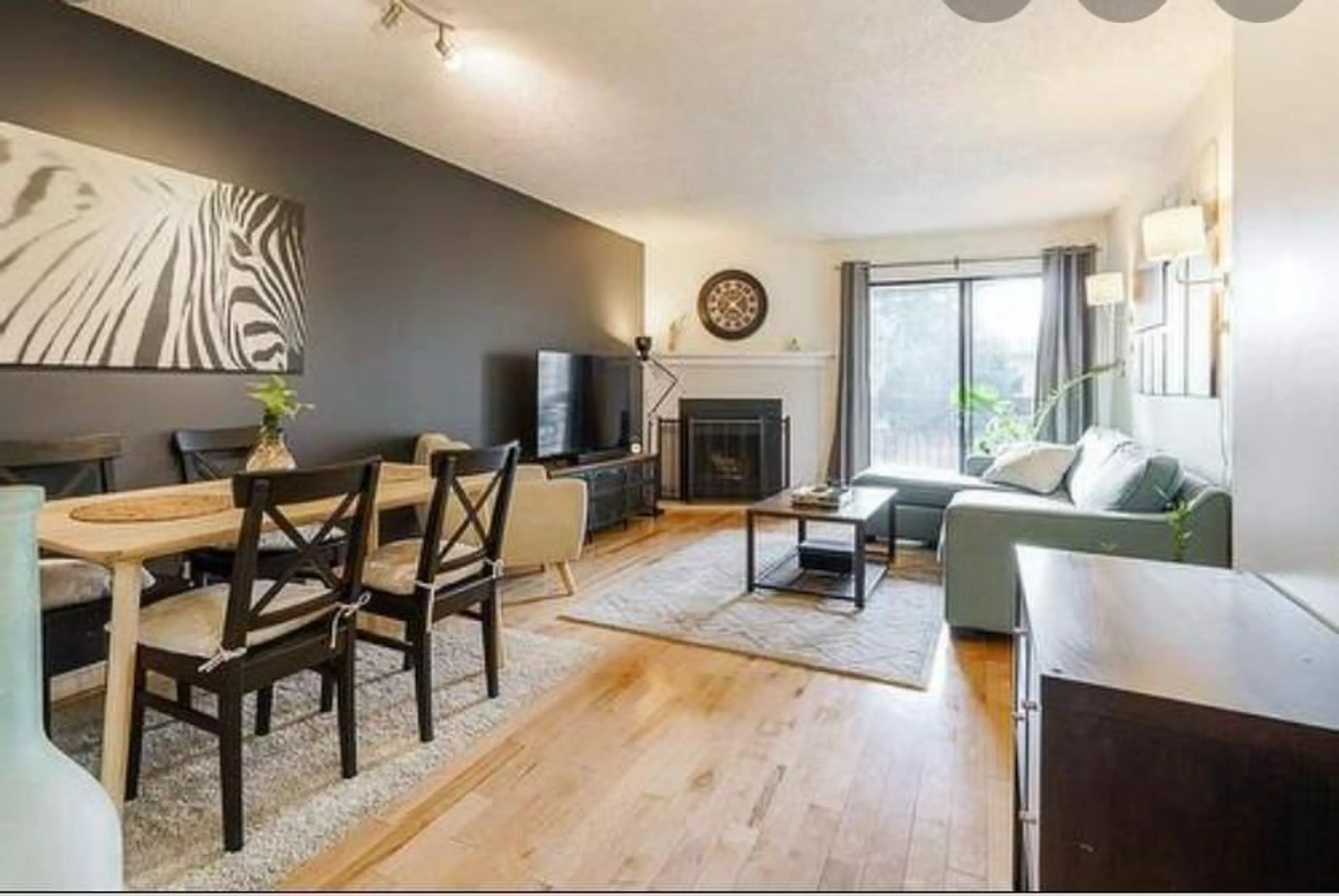 Living room with furniture, wood/laminate floor for 201 - 10560 154, Surrey British Columbia V3R8A3