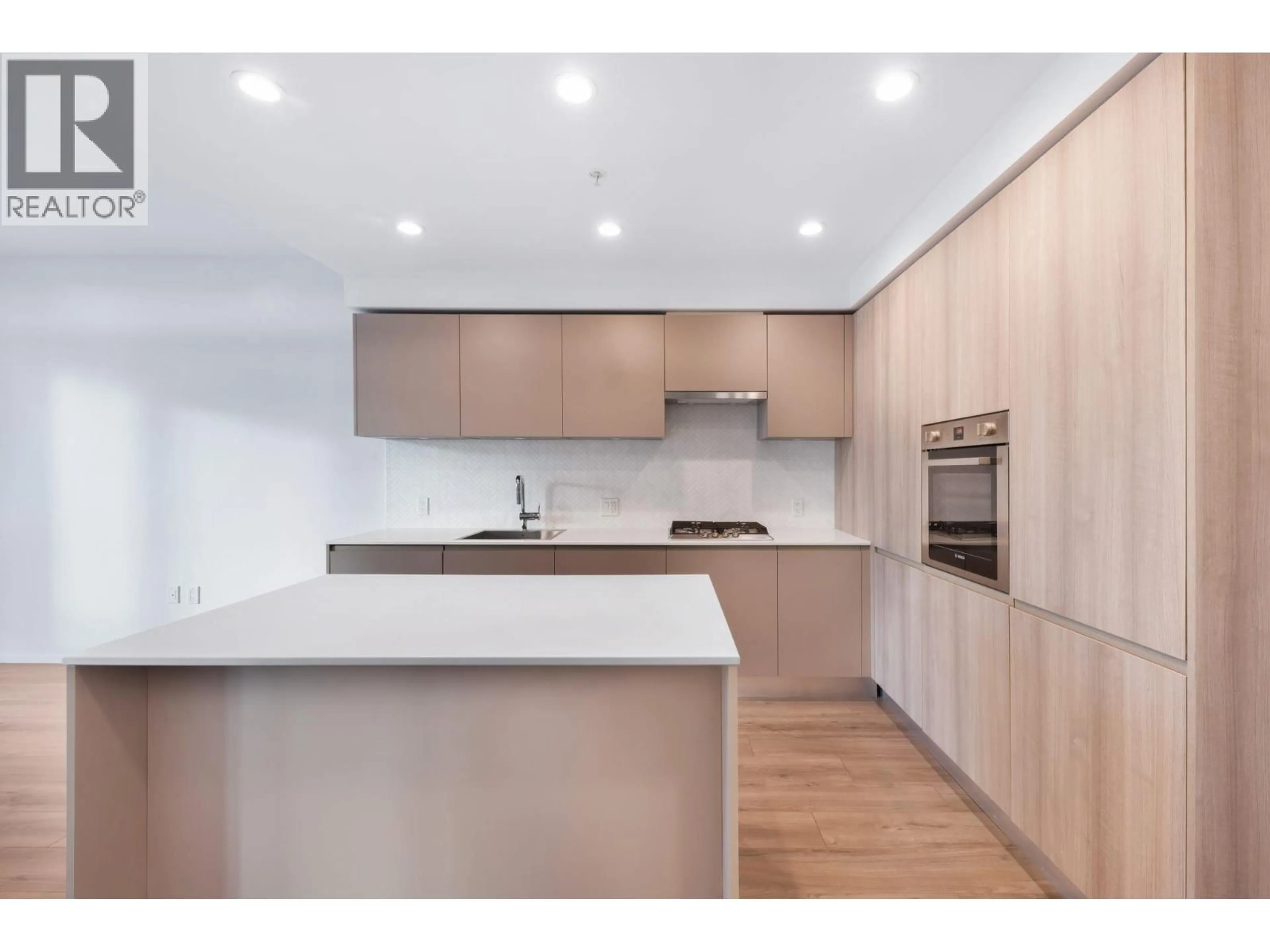 Open concept kitchen, wood/laminate floor for 309 - 3833 EVERGREEN PLACE, Burnaby British Columbia V3J0M2