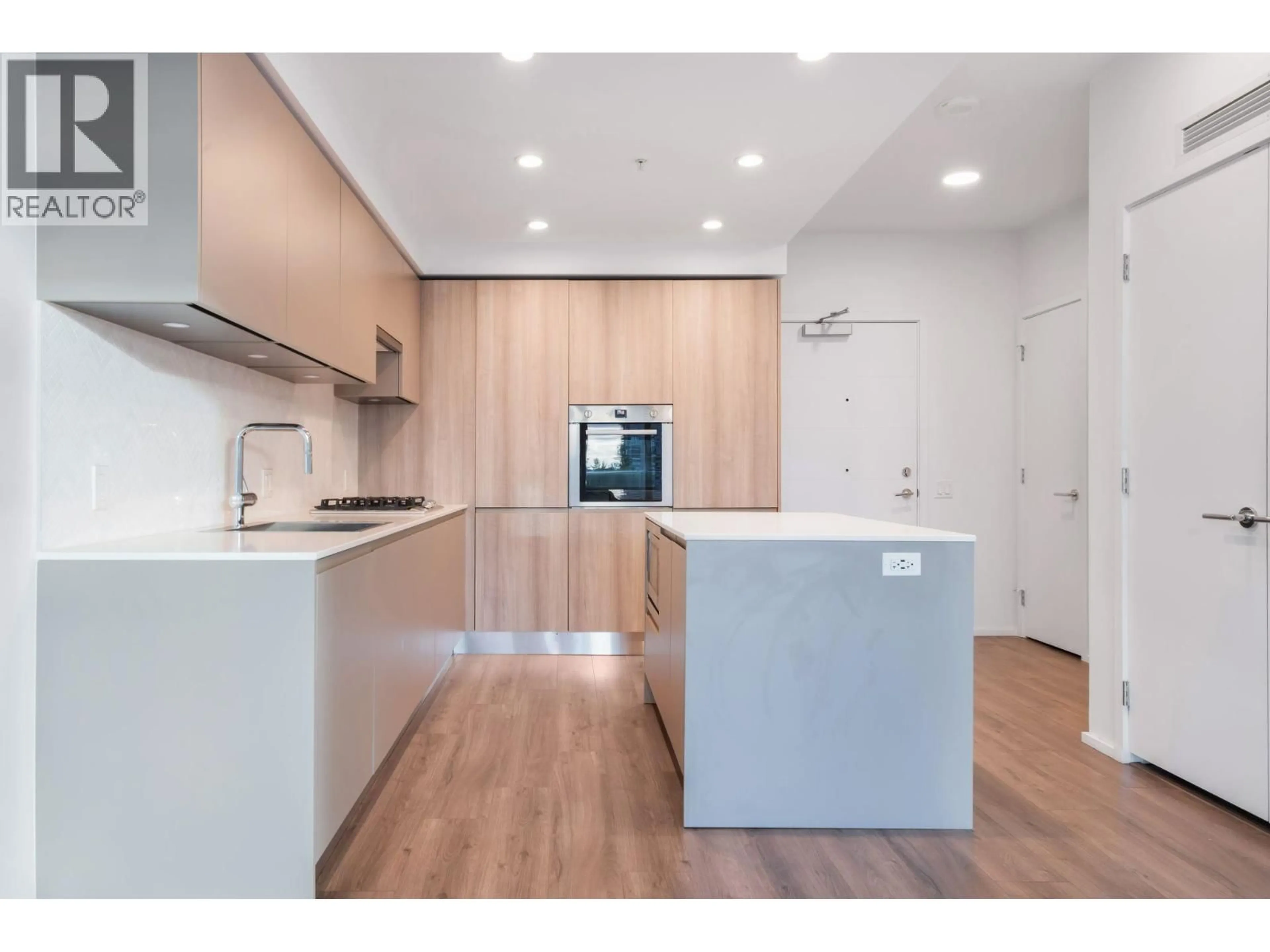 Open concept kitchen, wood/laminate floor for 309 - 3833 EVERGREEN PLACE, Burnaby British Columbia V3J0M2