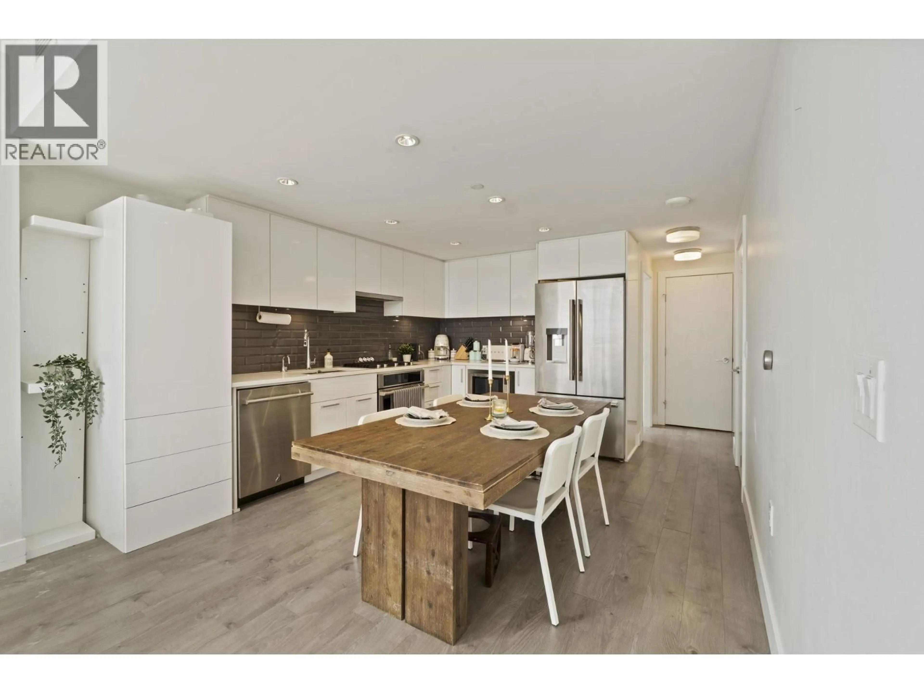Open concept kitchen, wood/laminate floor for 506 - 3451 SAWMILL CRESCENT, Vancouver British Columbia V5S0H3
