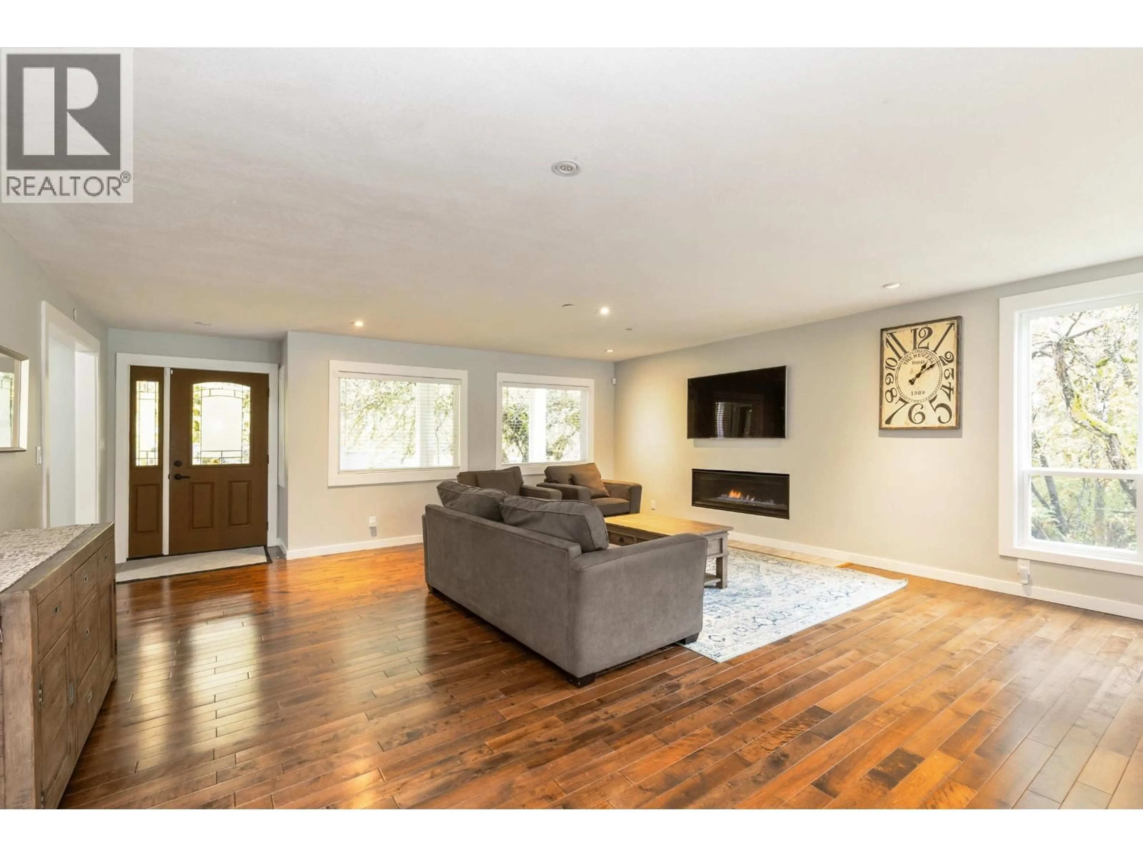 Living room with furniture, wood/laminate floor for 24445 104 AVENUE, Maple Ridge British Columbia V2W1J2