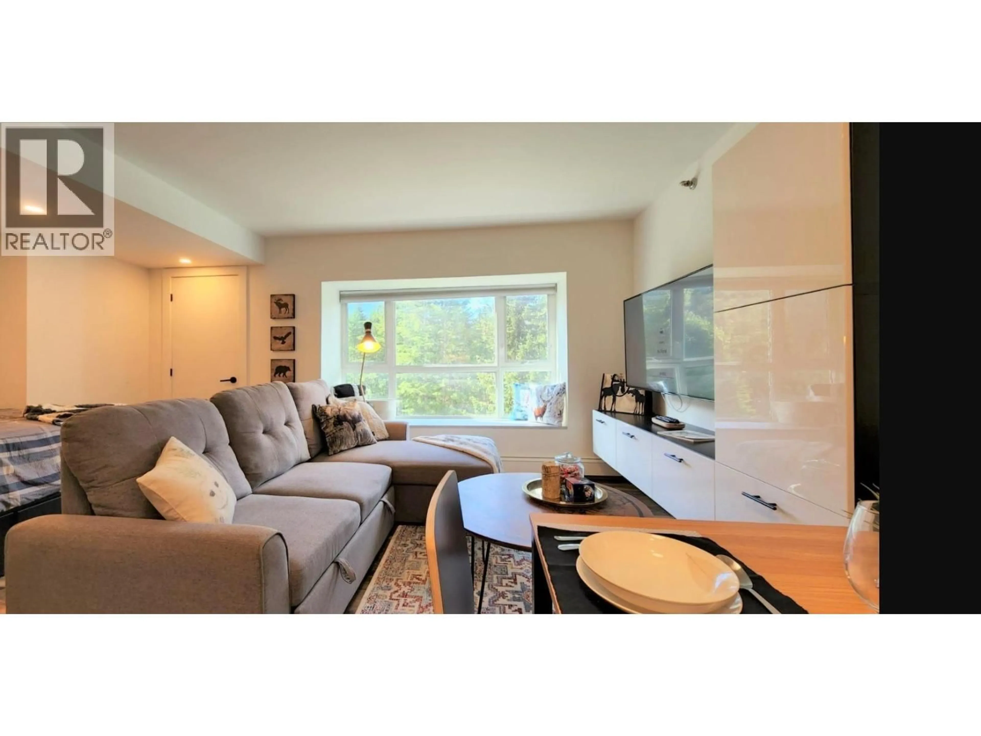 Living room with furniture, wood/laminate floor for 207 - 2111 WHISTLER ROAD, Whistler British Columbia V0N1B2