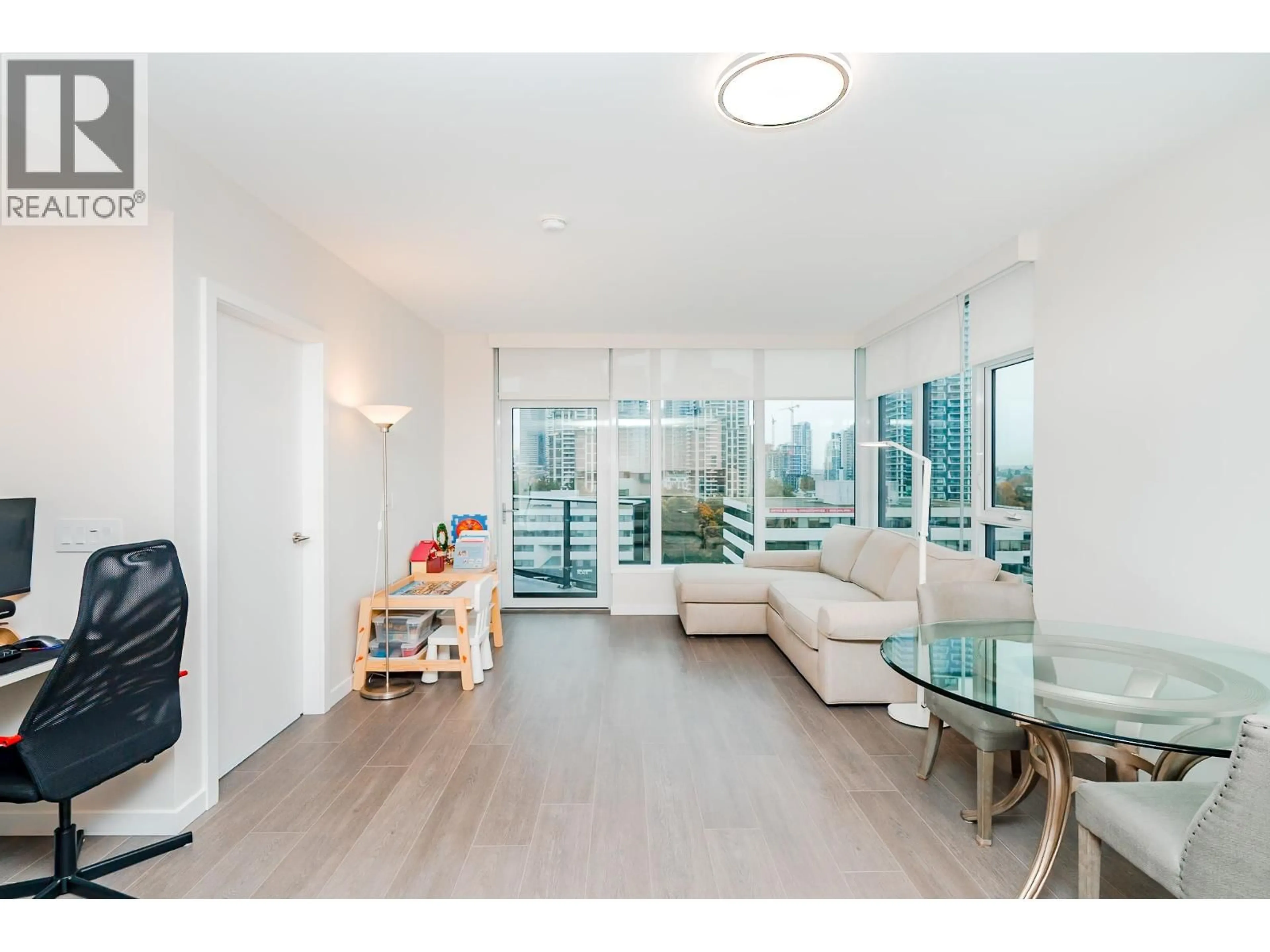 Living room with furniture, unknown for 1010 - 4168 LOUGHEED HIGHWAY, Burnaby British Columbia V5C0N9