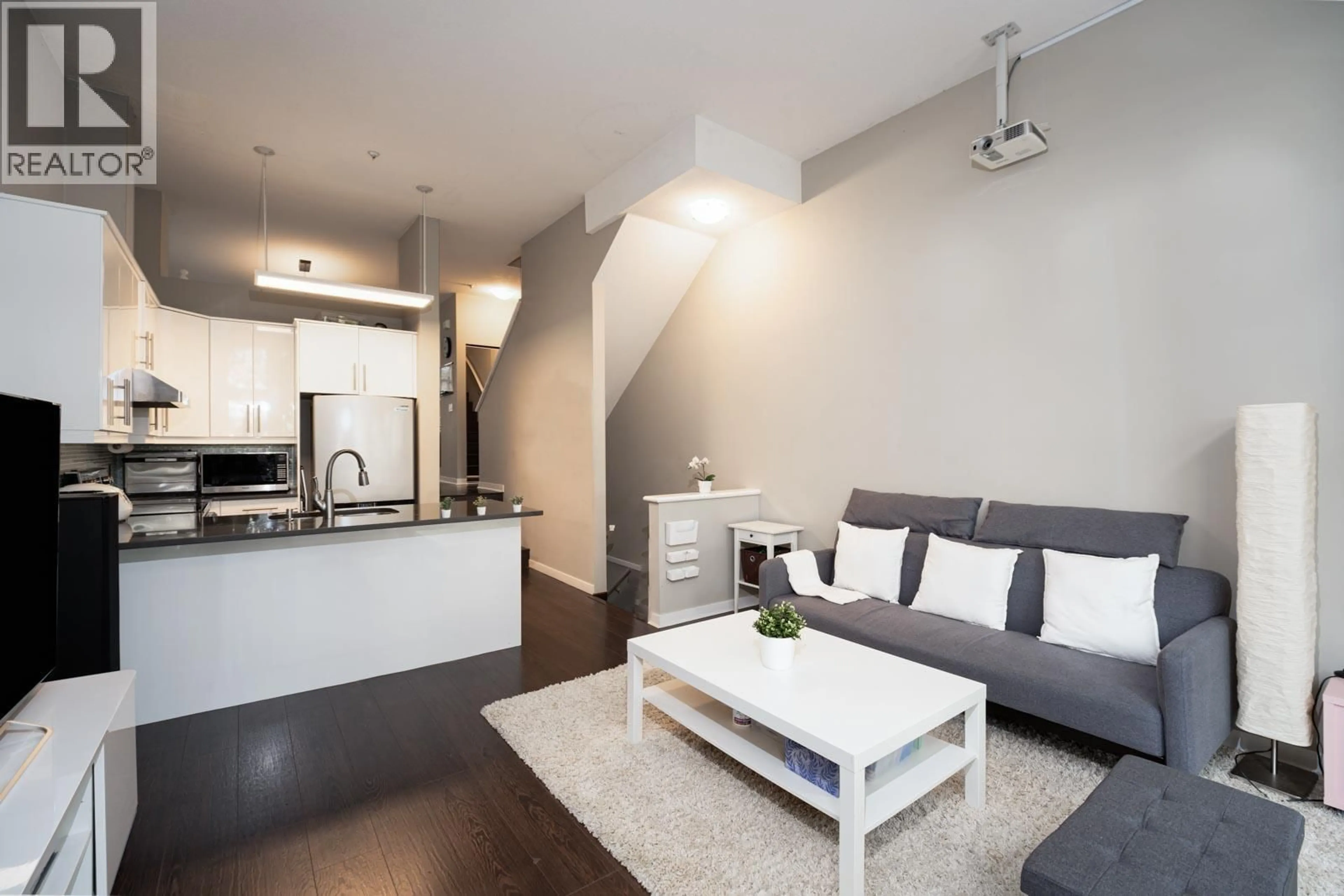 Living room with furniture, wood/laminate floor for 1 - 3586 RAINIER PLACE, Vancouver British Columbia V5S4T3