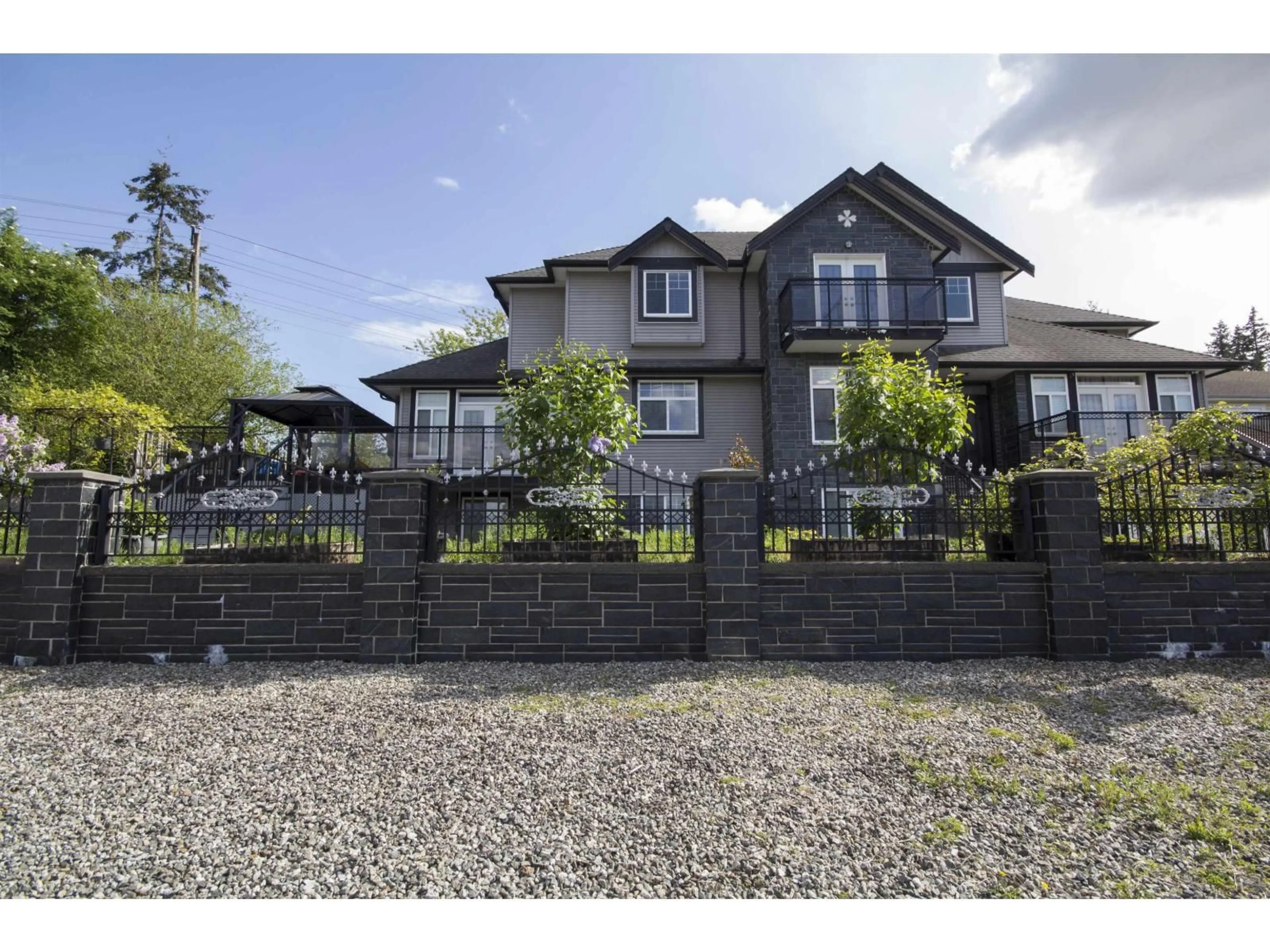 A pic from outside/outdoor area/front of a property/back of a property/a pic from drone, street for 12136 100A, Surrey British Columbia V3V2Y5