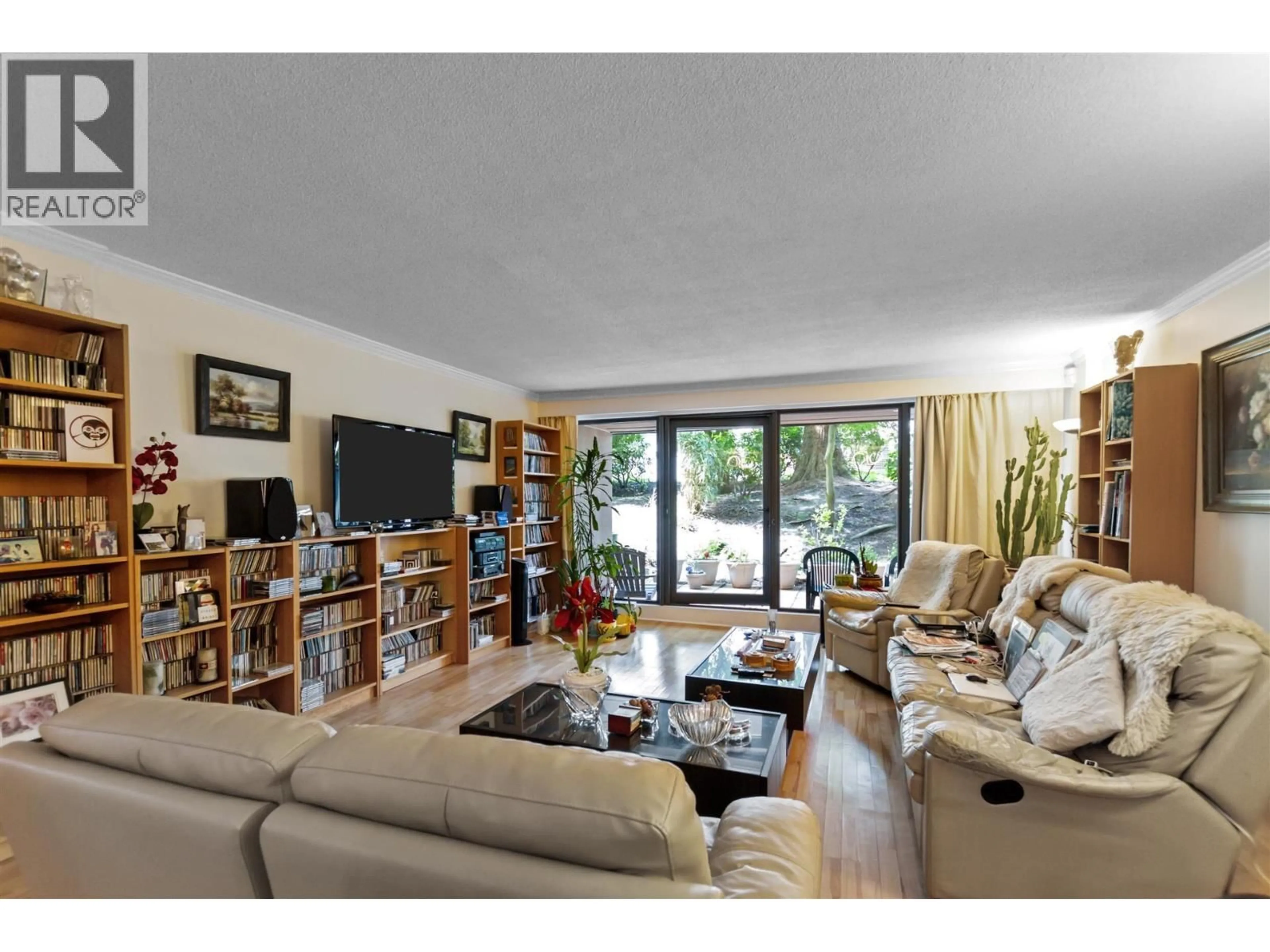 Living room with furniture, wood/laminate floor for 10 - 1425 LAMEY'S MILL ROAD, Vancouver British Columbia V6H3W2