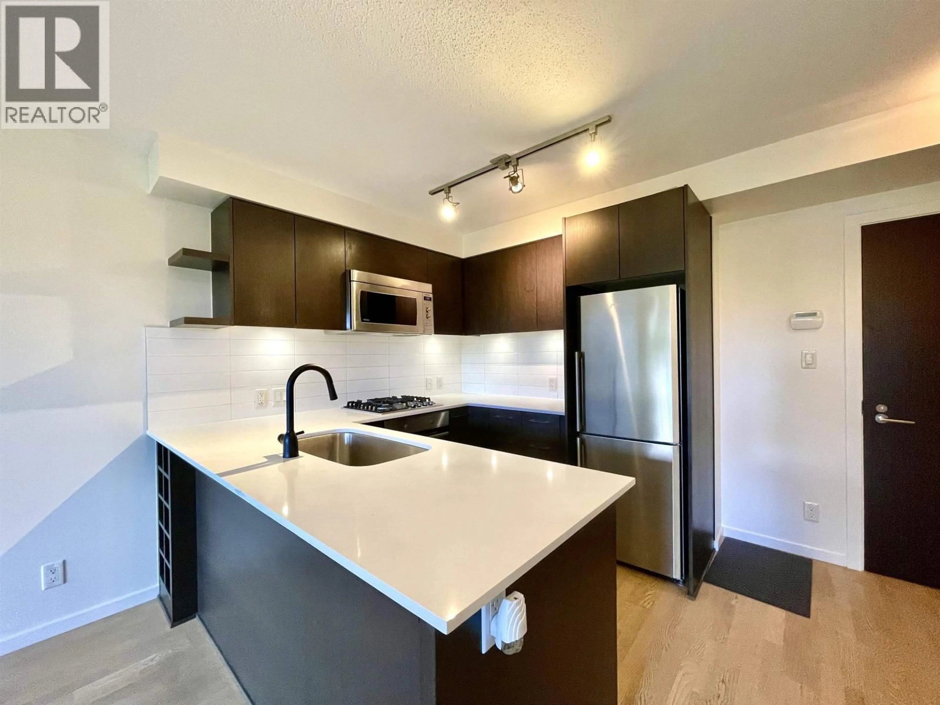 Open concept kitchen, unknown for 707 - 7733 FIRBRIDGE WAY, Richmond British Columbia V6X0M7