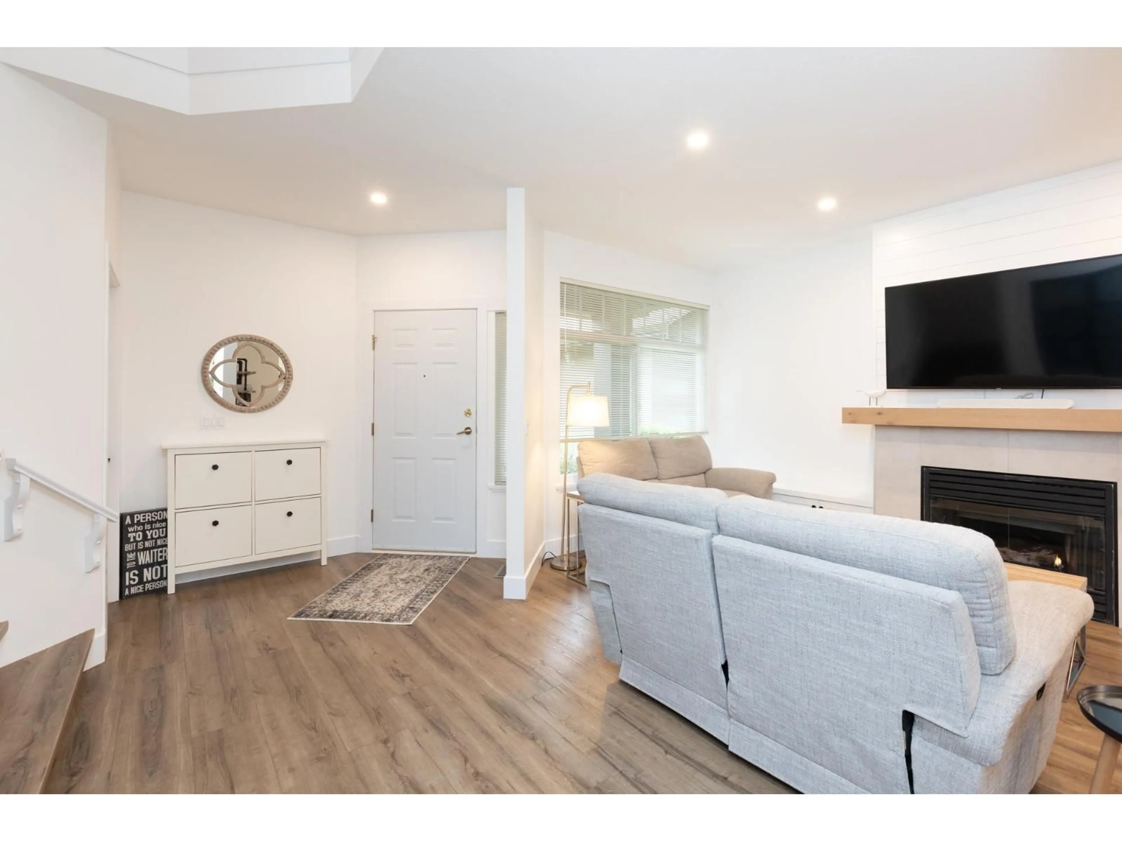 Living room with furniture, wood/laminate floor for 12 - 15151 26, Surrey British Columbia V4P2Z8