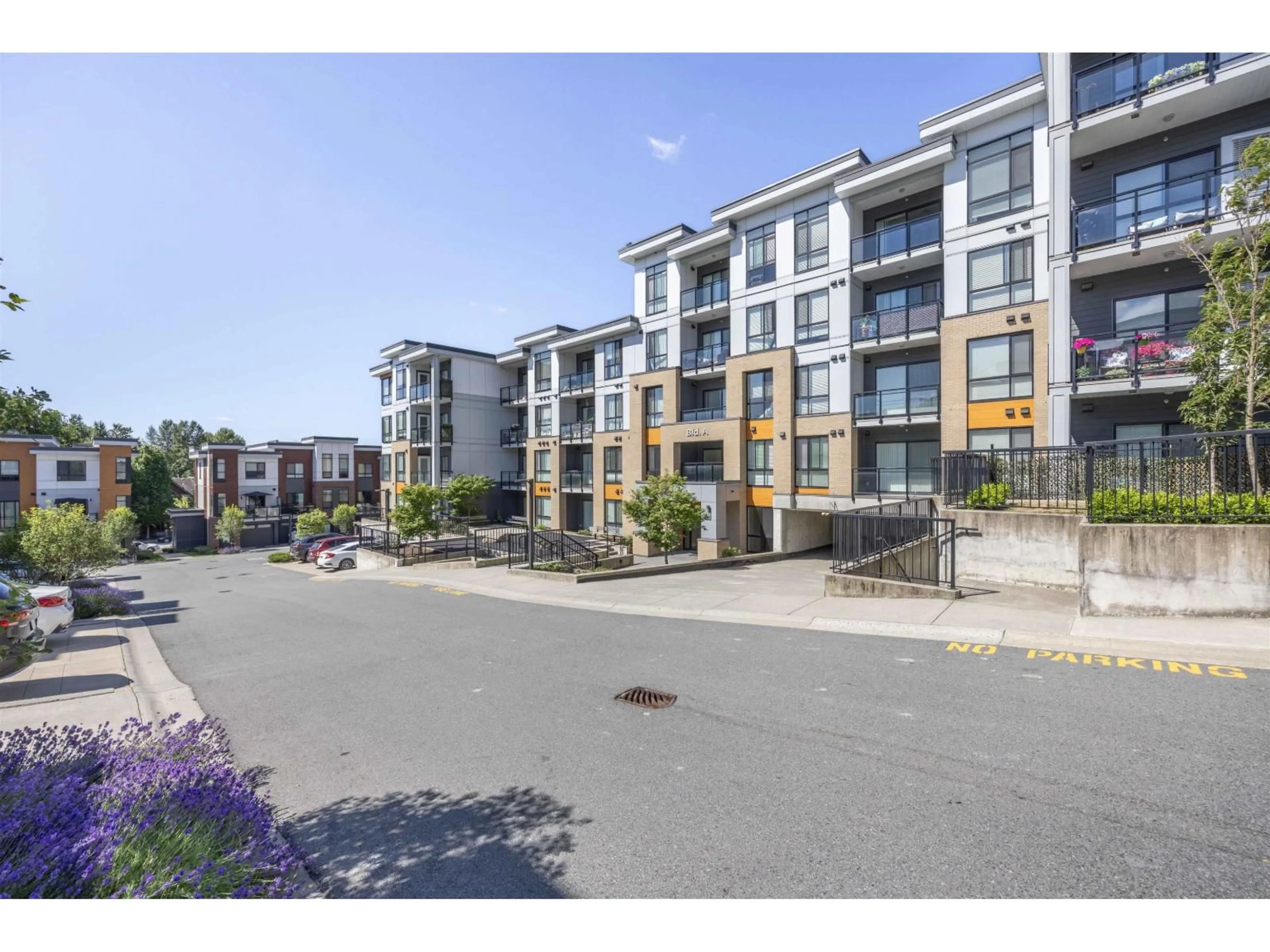 A pic from outside/outdoor area/front of a property/back of a property/a pic from drone, street for A003 - 20087 68, Langley British Columbia V2Y0Y2