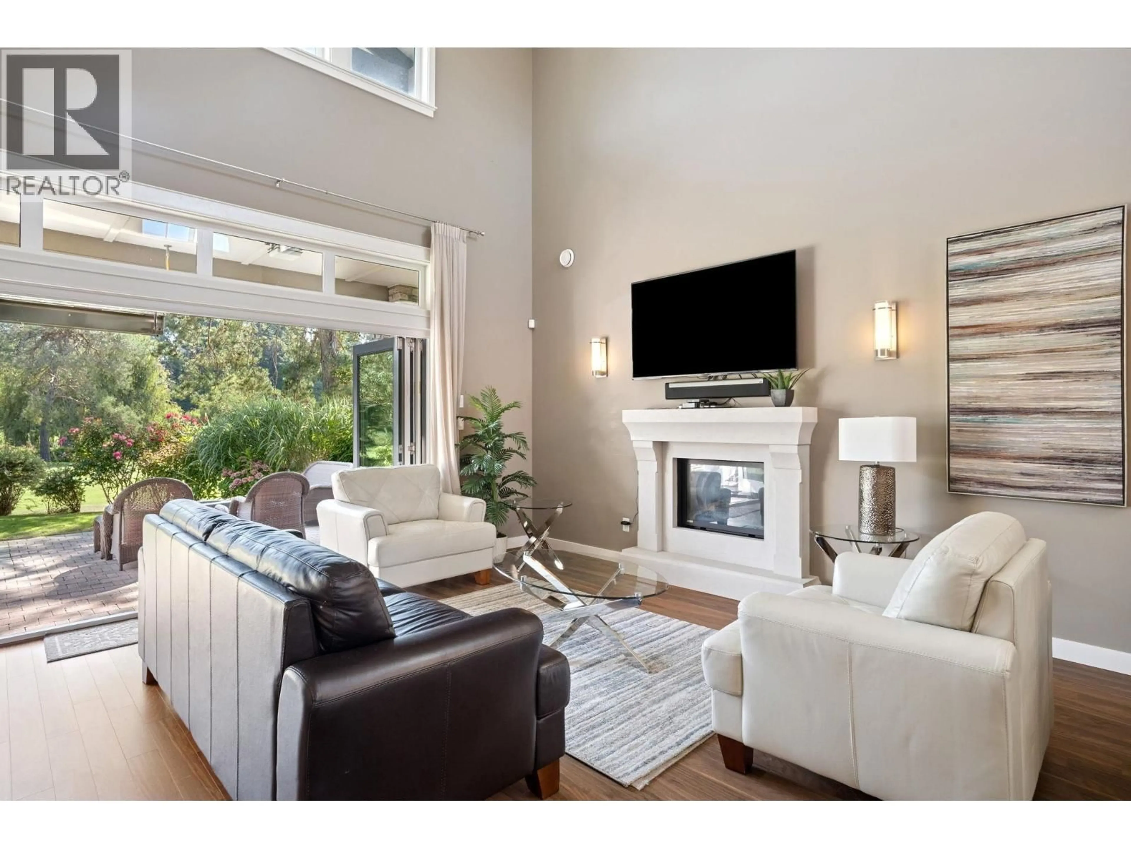 Living room with furniture, wood/laminate floor for 5044 CEDAR SPRINGS DRIVE, Delta British Columbia V4M0A7