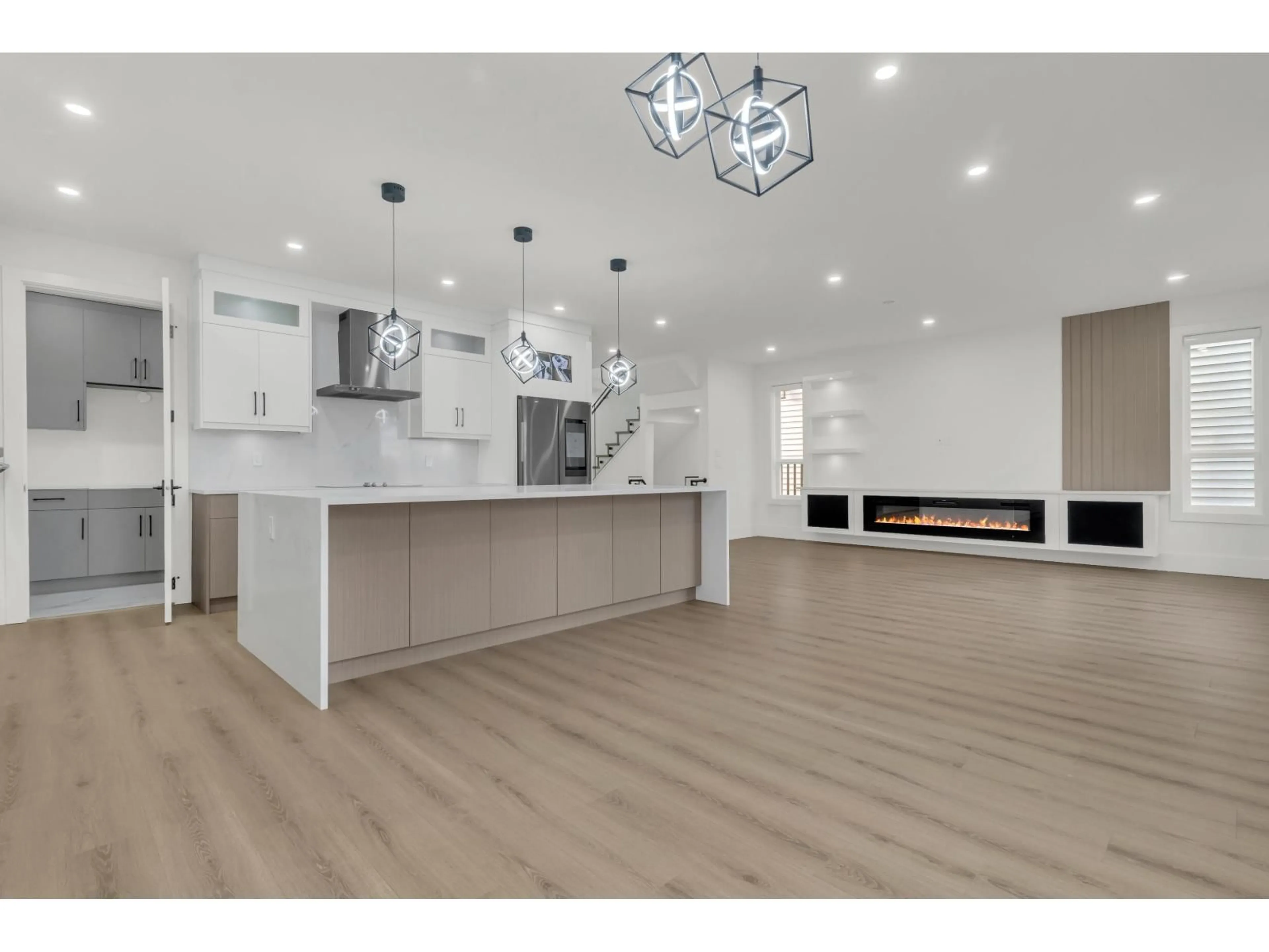 Open concept kitchen, wood/laminate floor for 7020 205, Langley British Columbia V2Y1S9