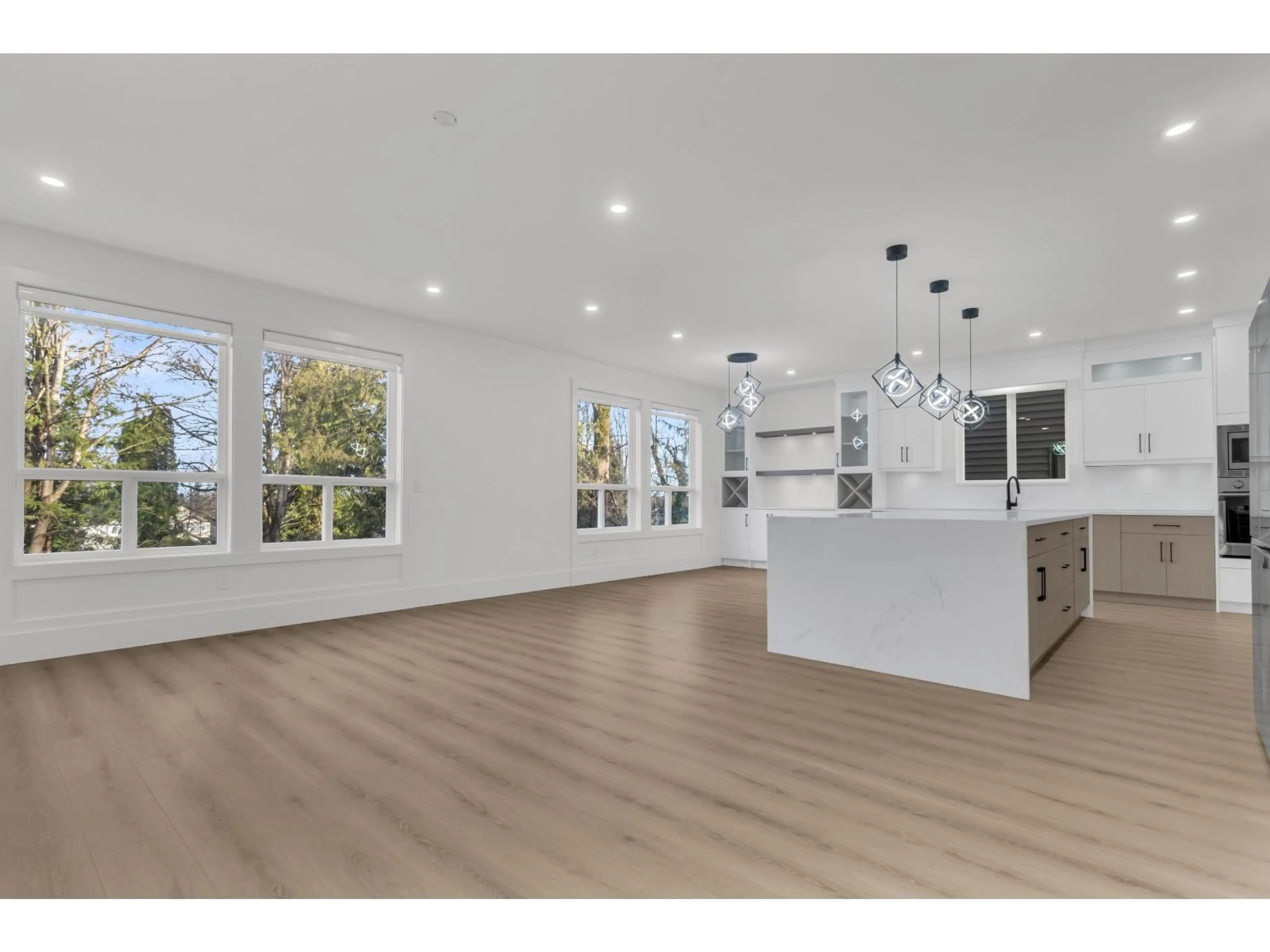 Open concept kitchen, wood/laminate floor for 7020 205, Langley British Columbia V2Y1S9