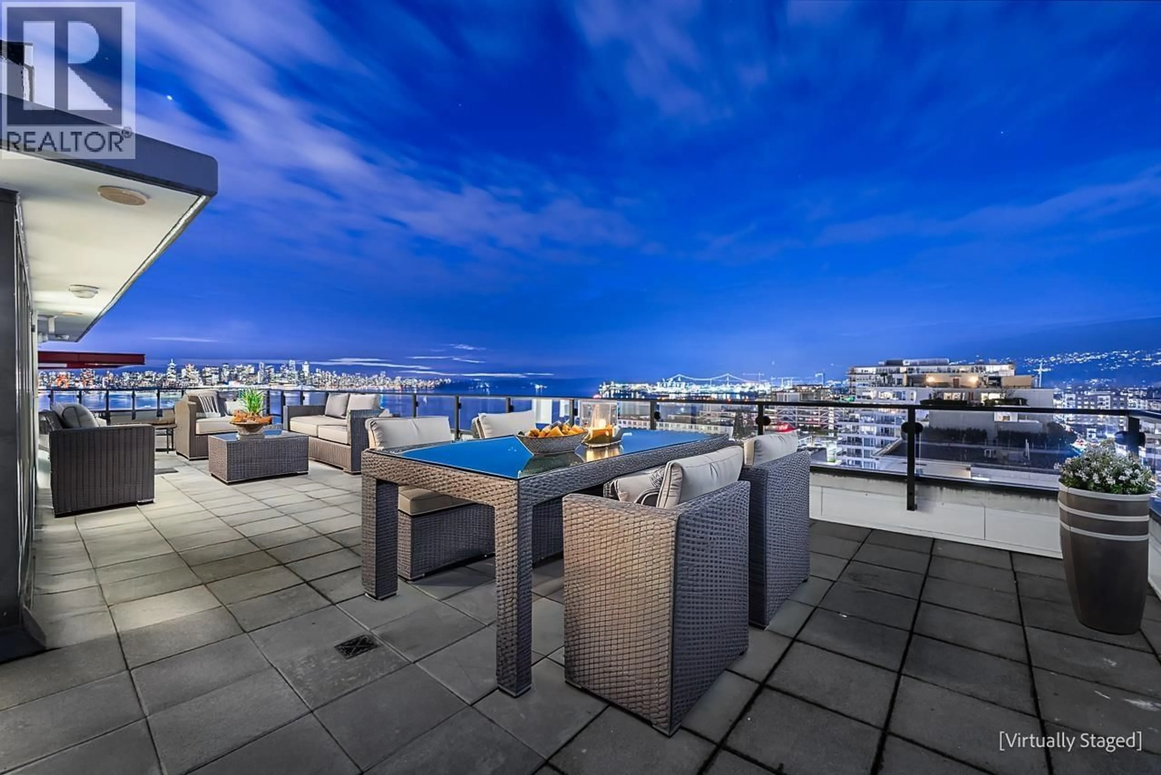 Patio, city buildings view from balcony for PH3 - 162 VICTORY SHIP WAY, North Vancouver British Columbia V7L0B4