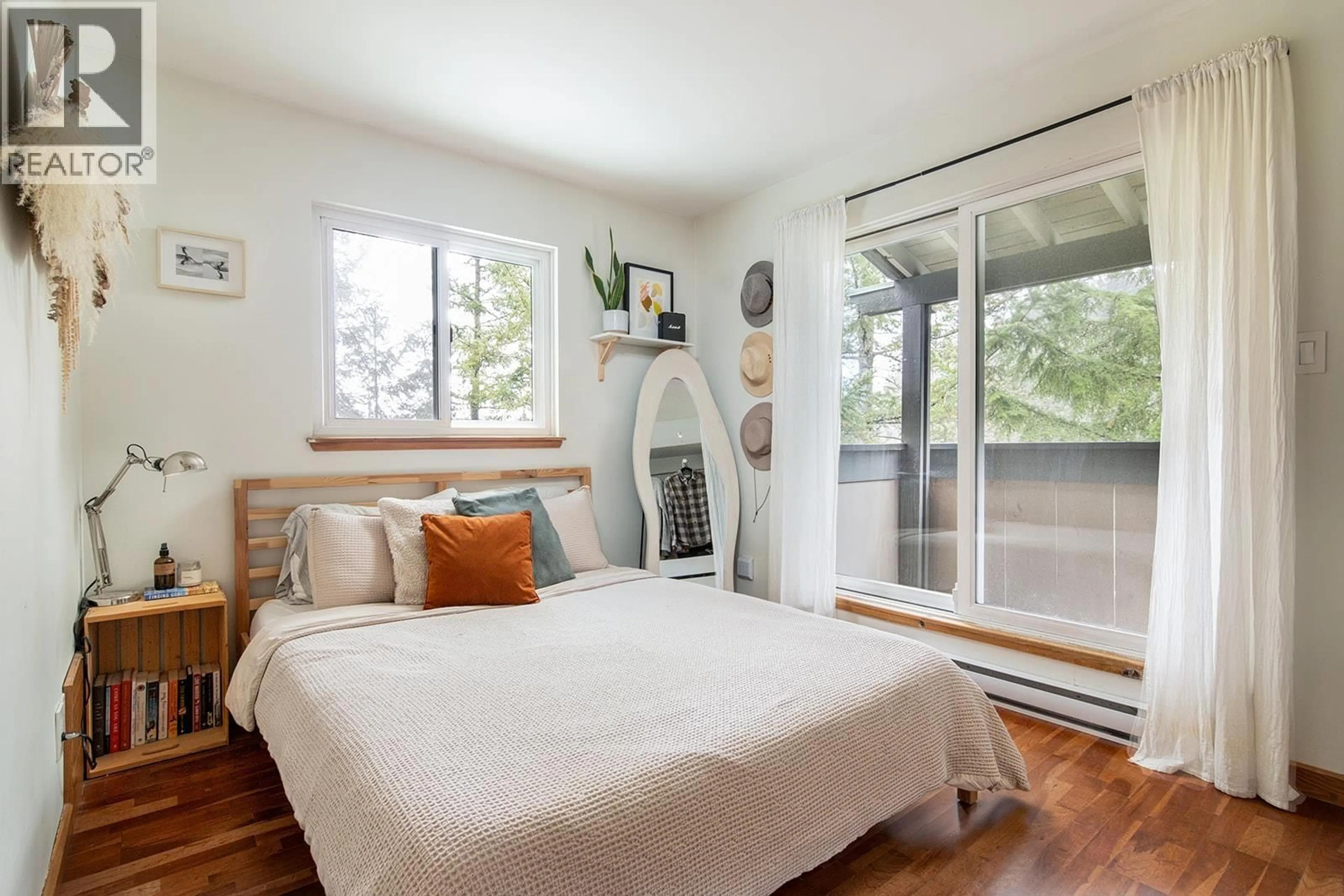 Bedroom with bed, wood/laminate floor for 404 - 2101 CASTLE DRIVE, Whistler British Columbia V8E0A6