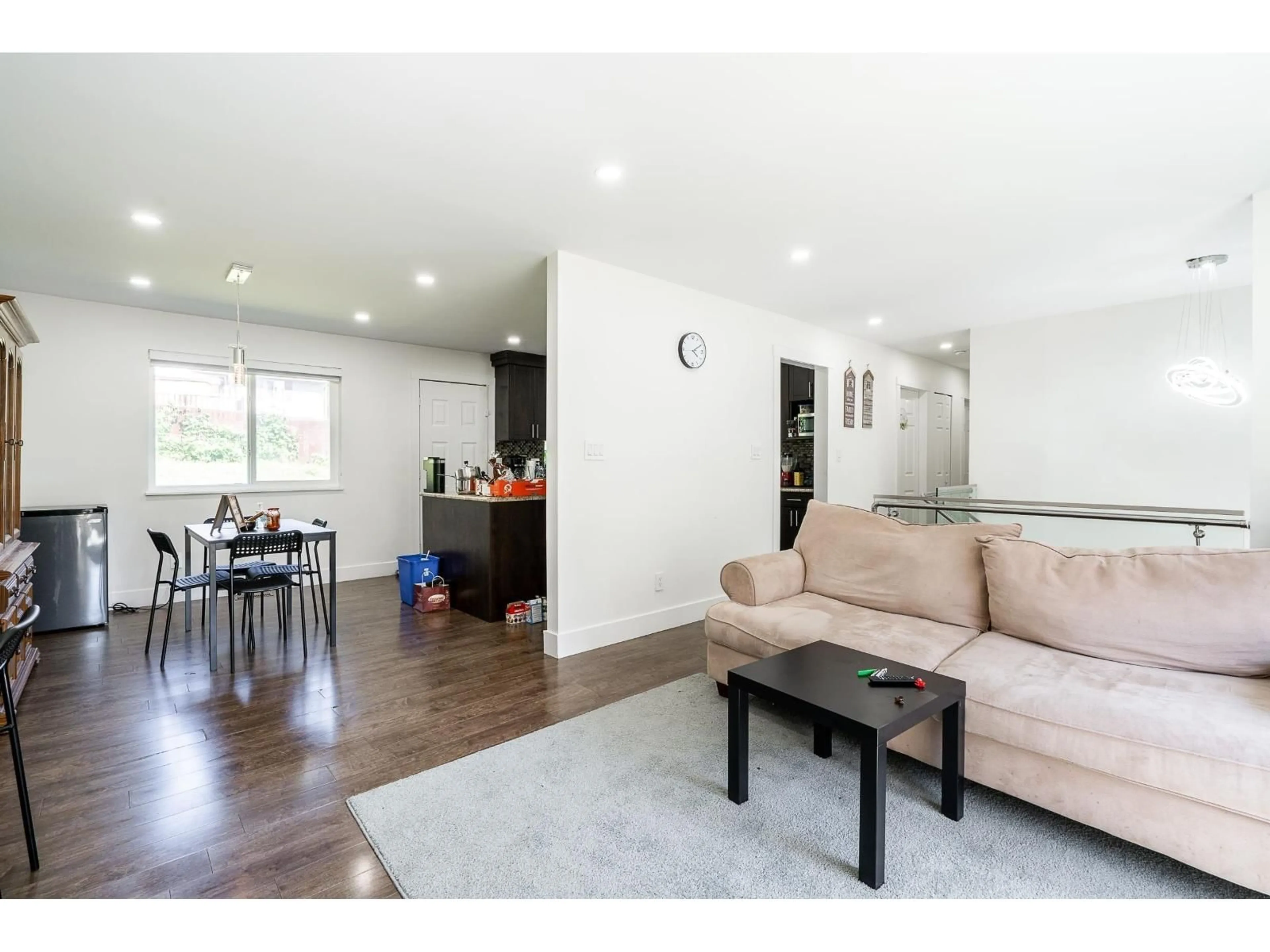 Living room with furniture, wood/laminate floor for 7902 HERON STREET, Mission British Columbia V2V6A1