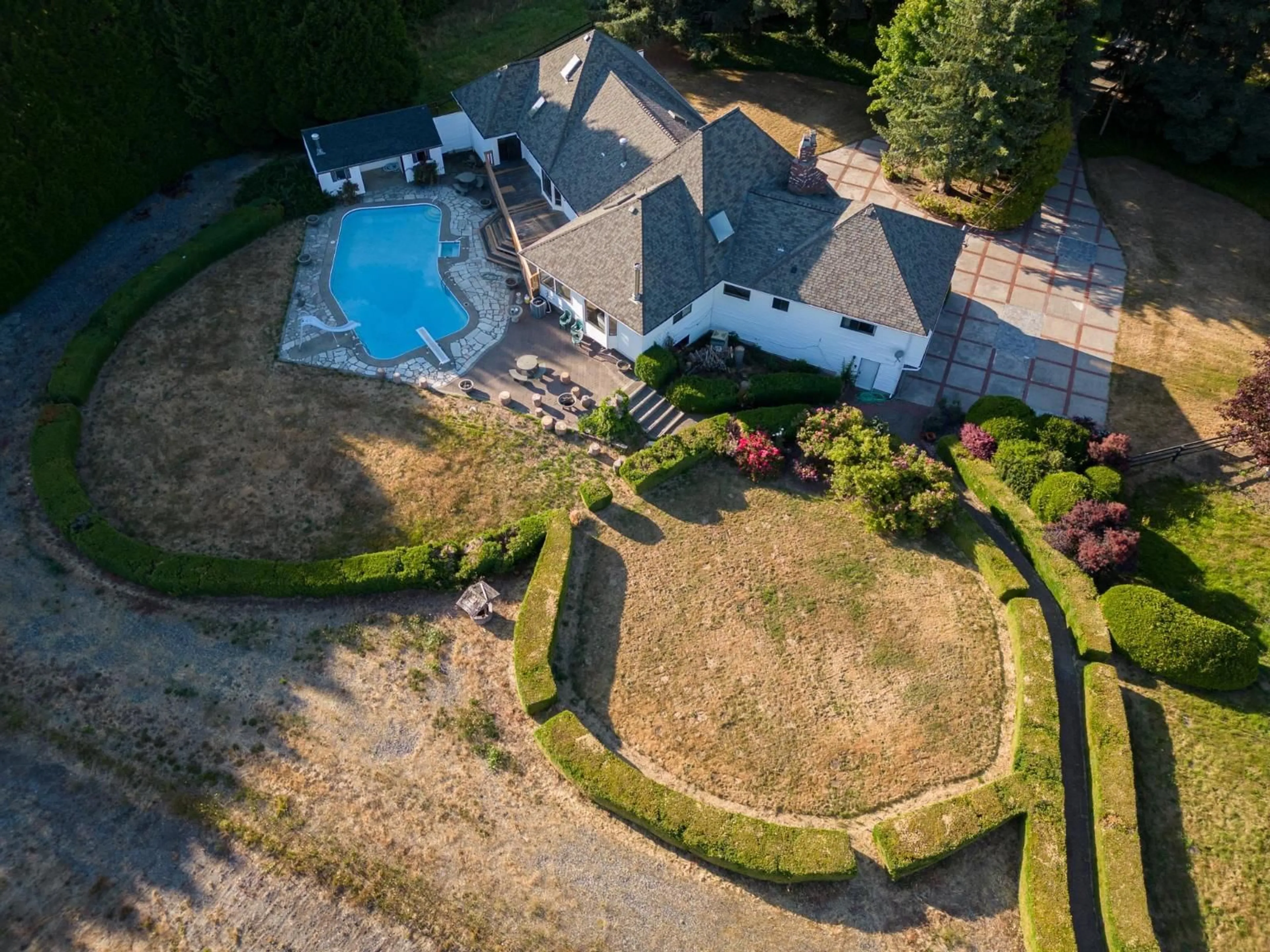 A pic from outside/outdoor area/front of a property/back of a property/a pic from drone, water/lake/river/ocean view for 21480 18, Langley British Columbia V2Z2G1