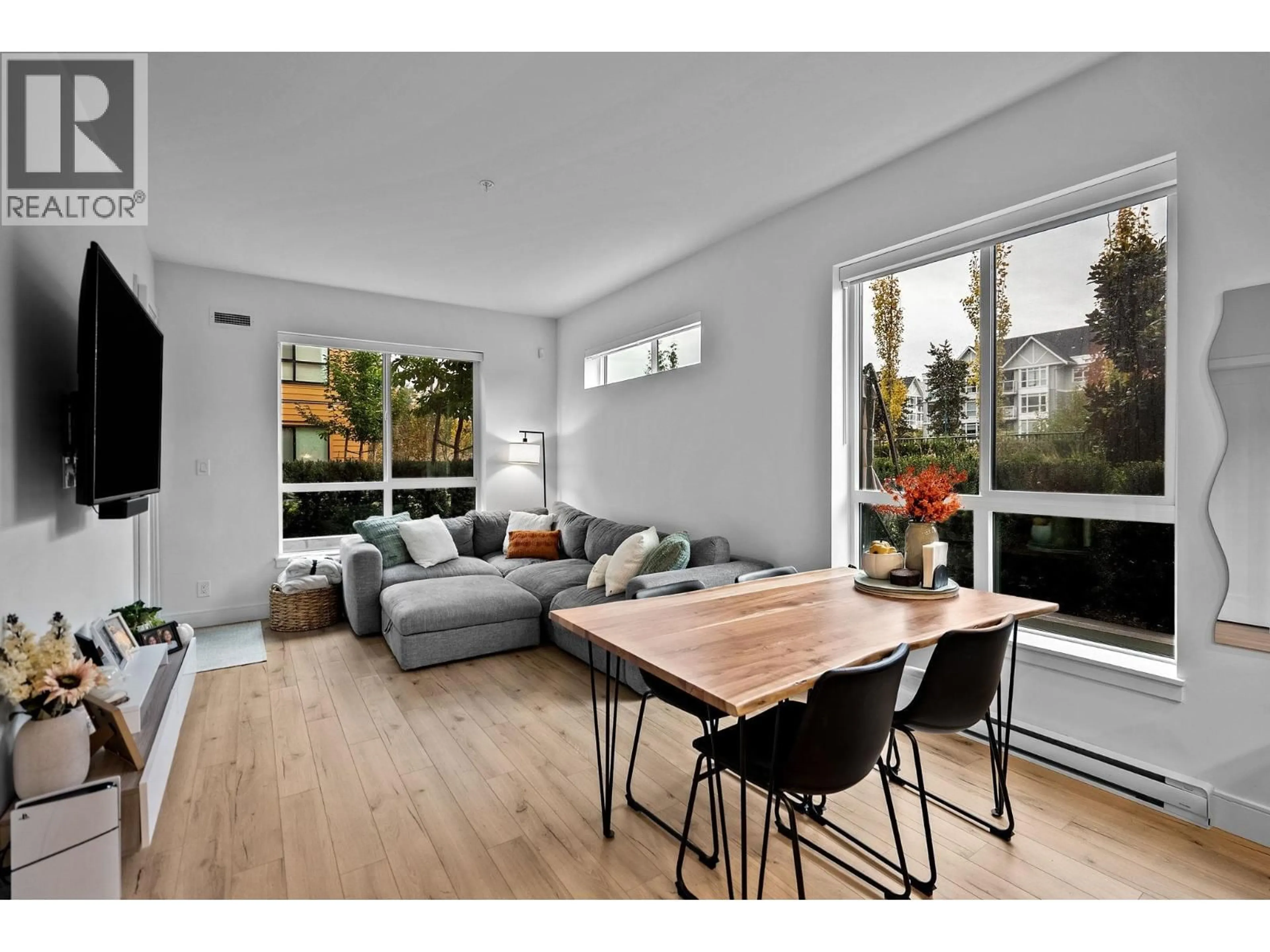 Living room with furniture, wood/laminate floor for 205 - 55 KLAHANIE DRIVE, Port Moody British Columbia V3H0M9