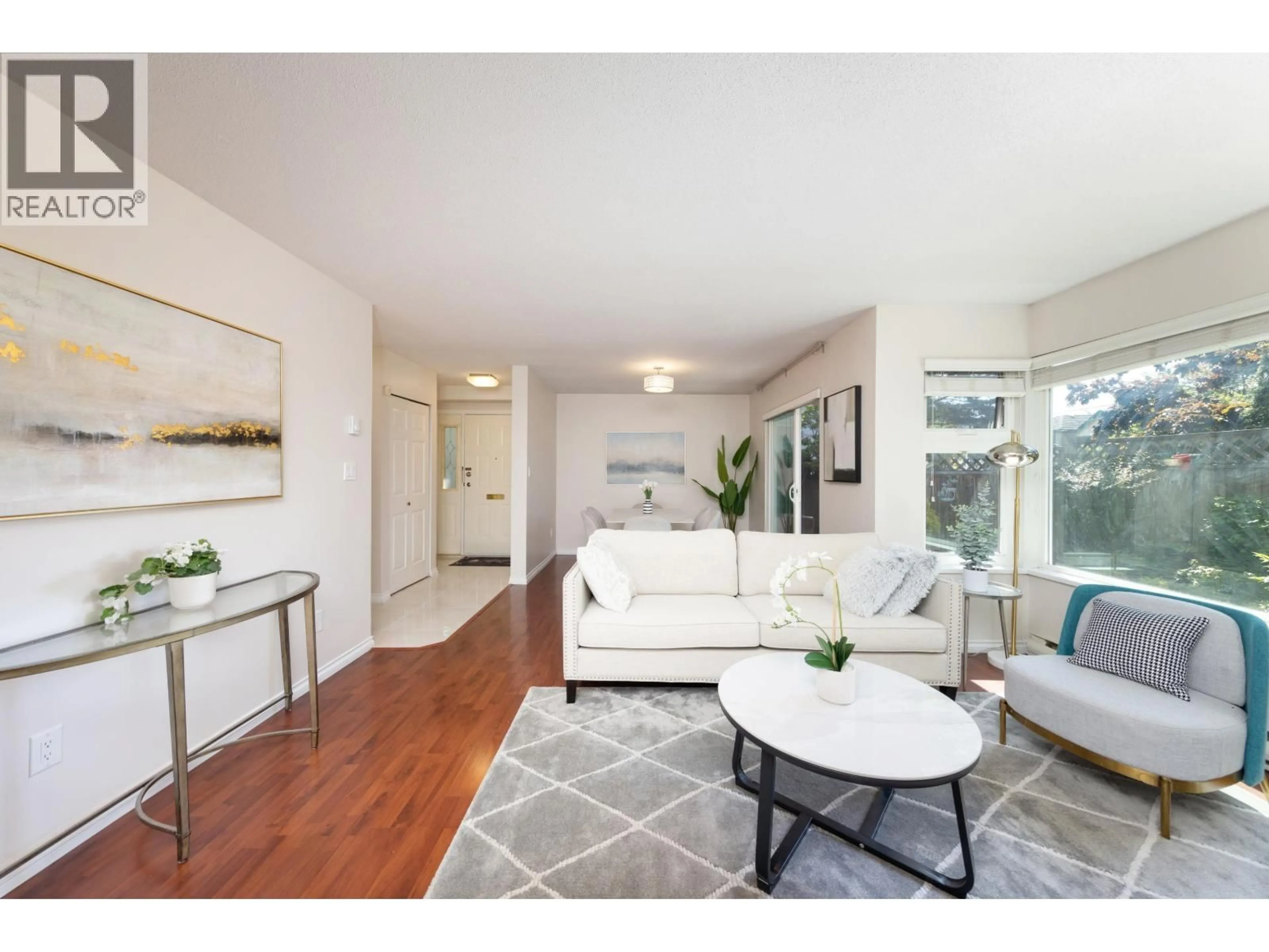 Living room with furniture, wood/laminate floor for 4 - 7171 BLUNDELL ROAD, Richmond British Columbia V6Y1J5