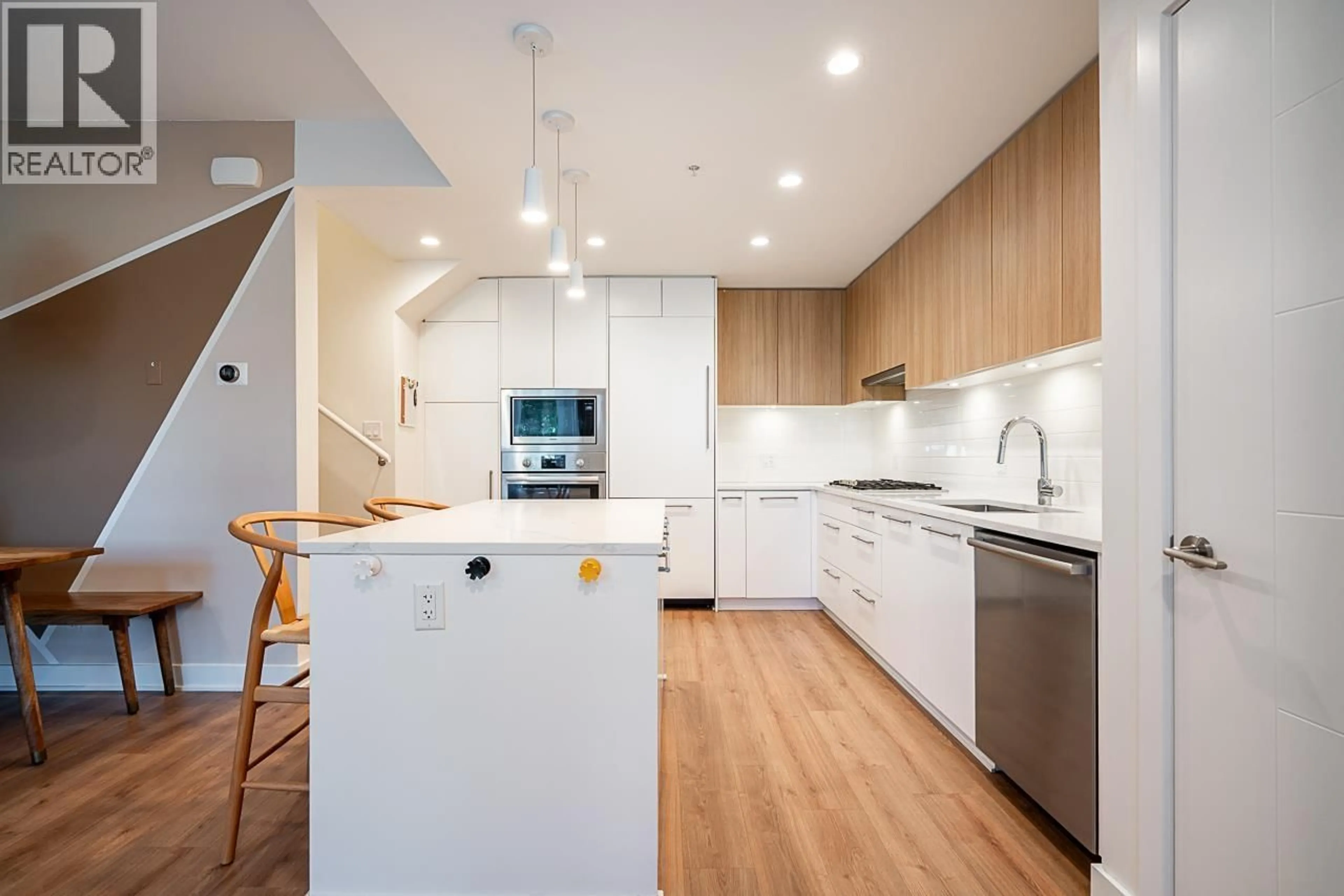 Contemporary kitchen, wood/laminate floor for 103 - 2035 GLENAIRE DRIVE, North Vancouver British Columbia V7P1Y2