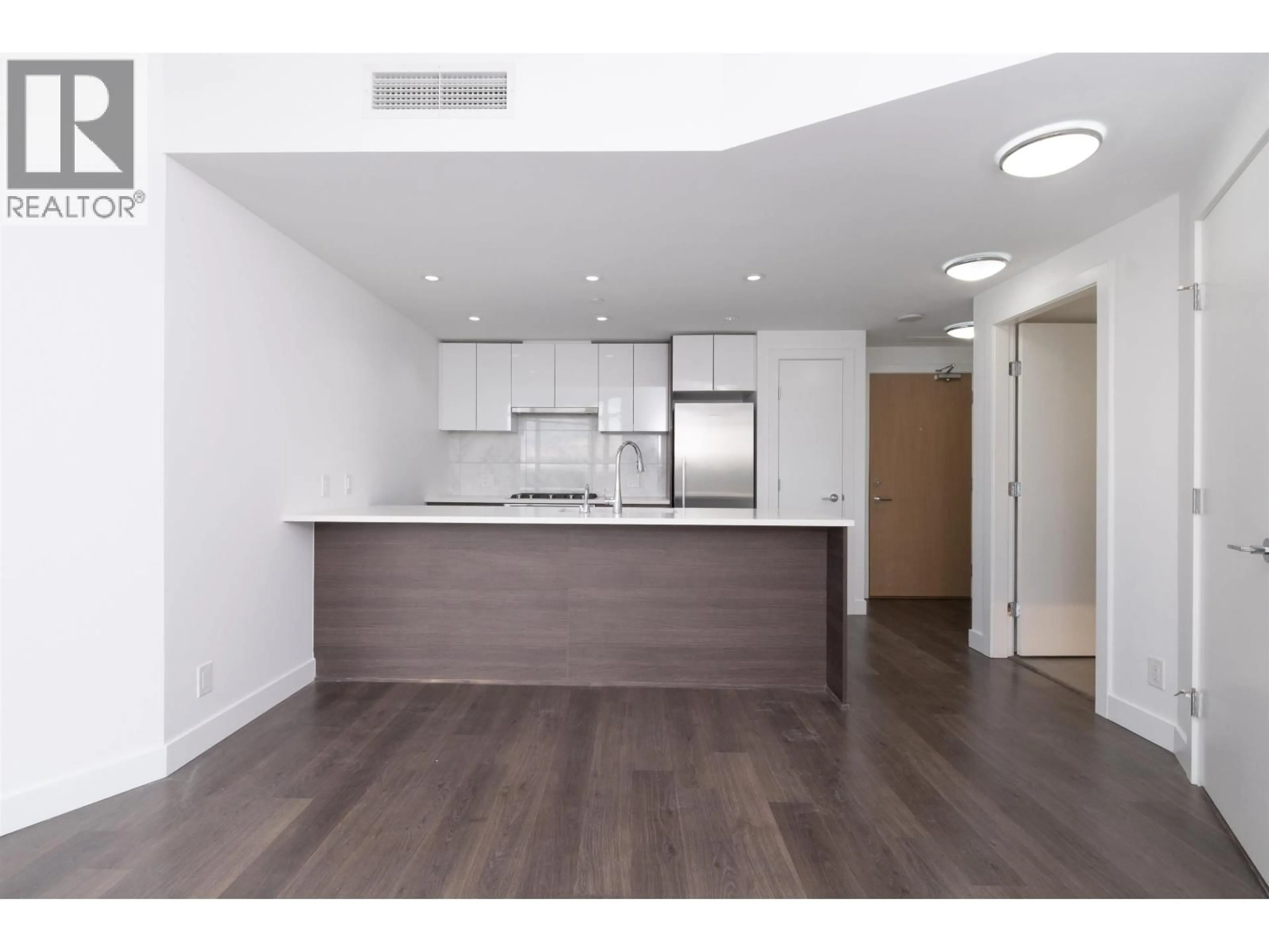 Open concept kitchen, wood/laminate floor for 912 - 3557 SAWMILL CRESCENT, Vancouver British Columbia V5S0E2