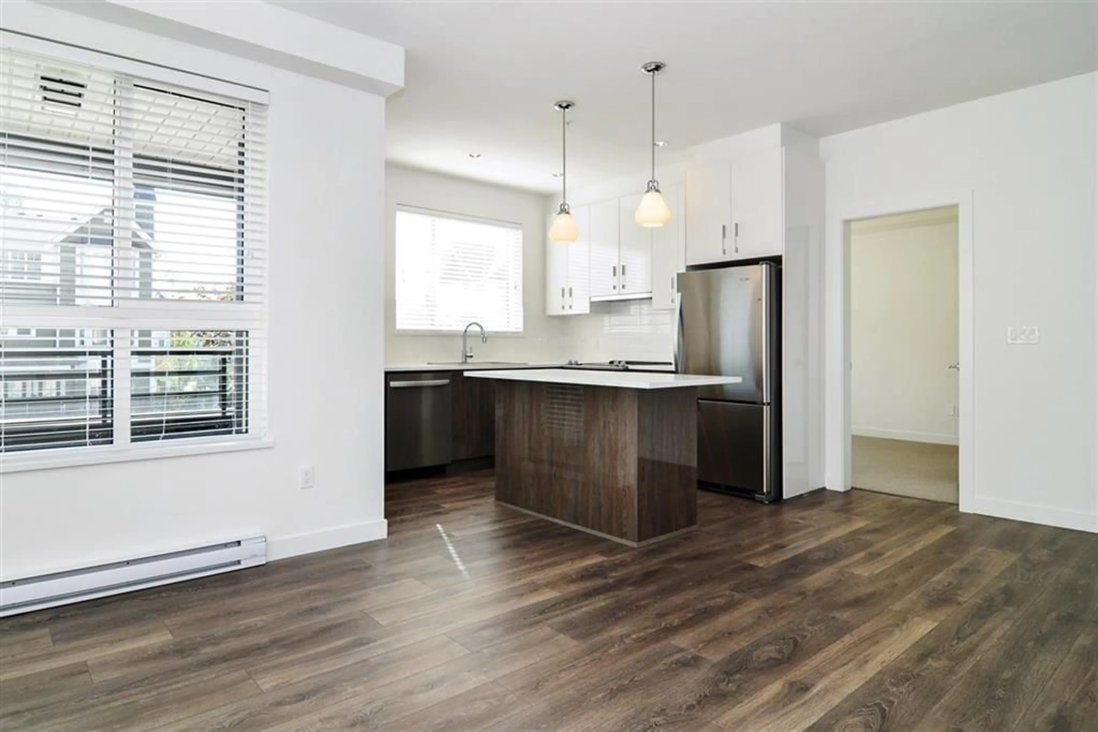 Open concept kitchen, wood/laminate floor for 216 - 20829 77A, Langley British Columbia V2Y0Y5