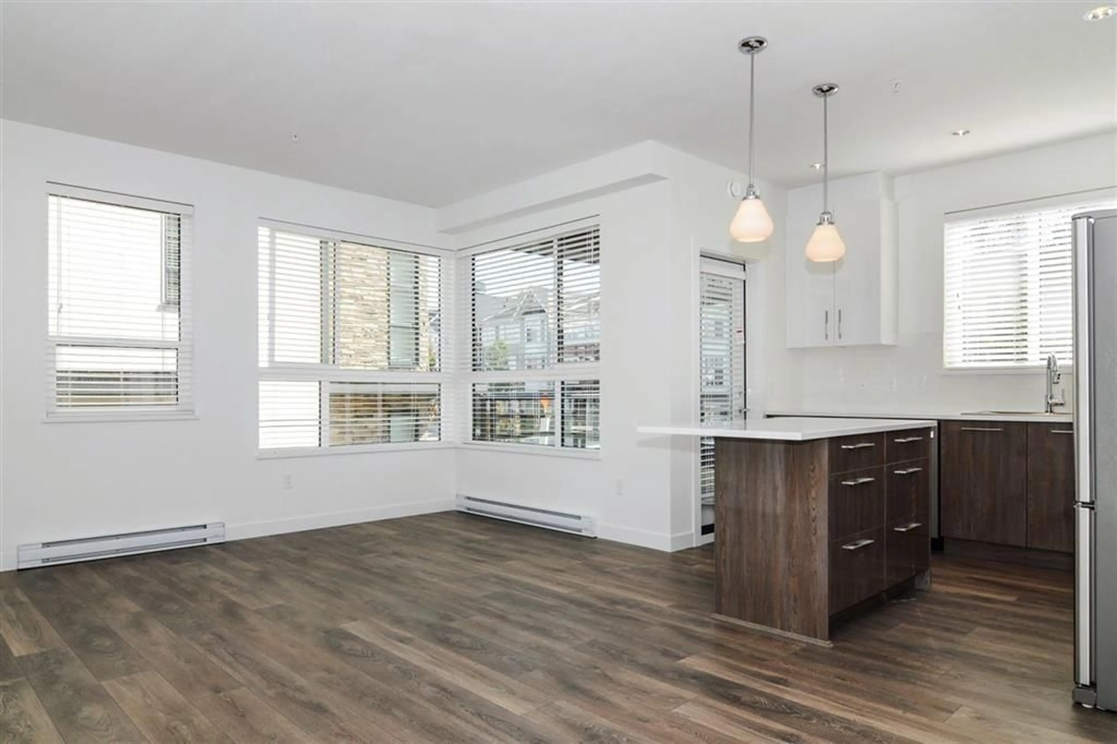 Open concept kitchen, wood/laminate floor for 216 - 20829 77A, Langley British Columbia V2Y0Y5