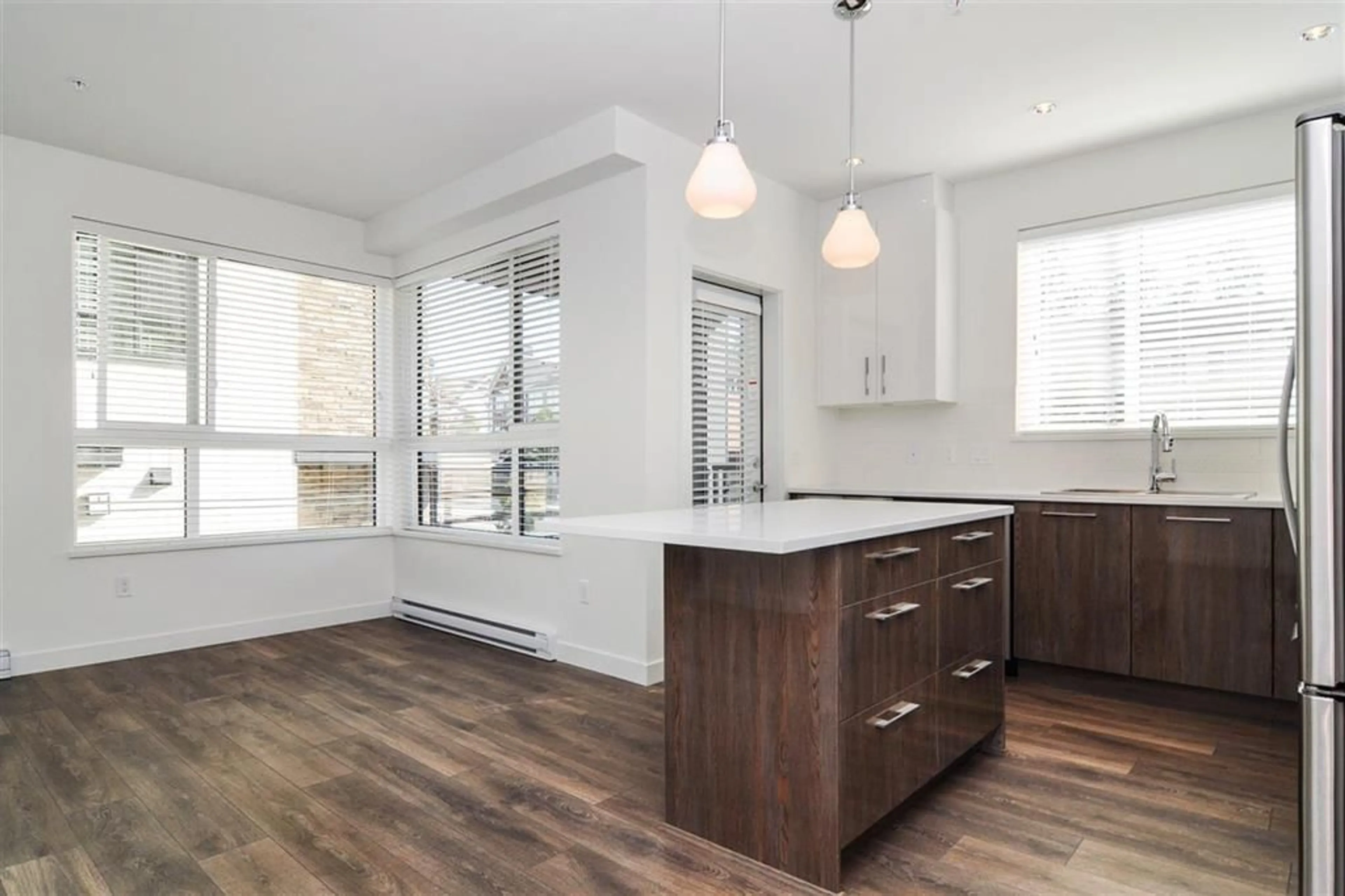 Open concept kitchen, wood/laminate floor for 216 - 20829 77A, Langley British Columbia V2Y0Y5