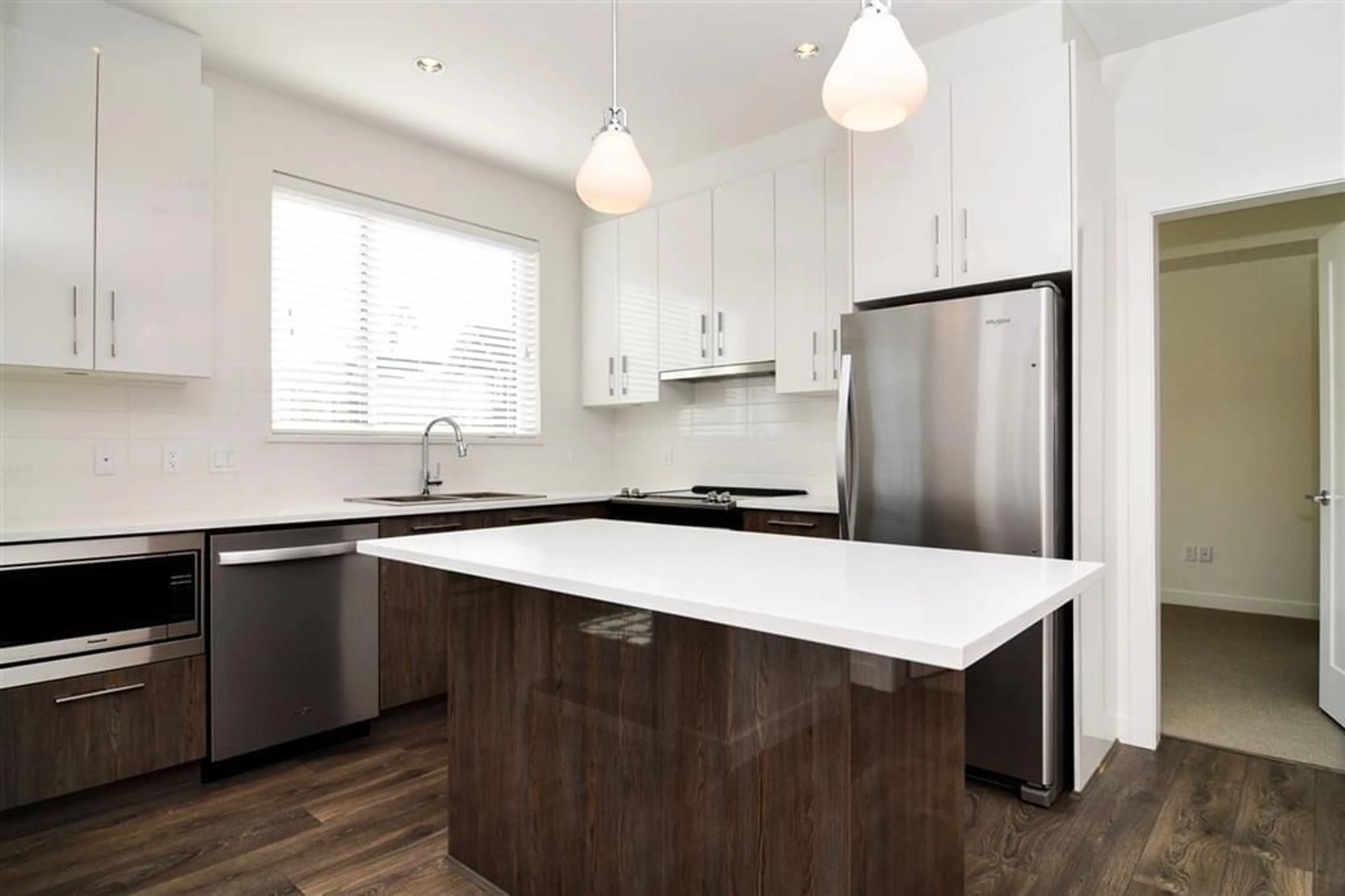 Open concept kitchen, wood/laminate floor for 216 - 20829 77A, Langley British Columbia V2Y0Y5
