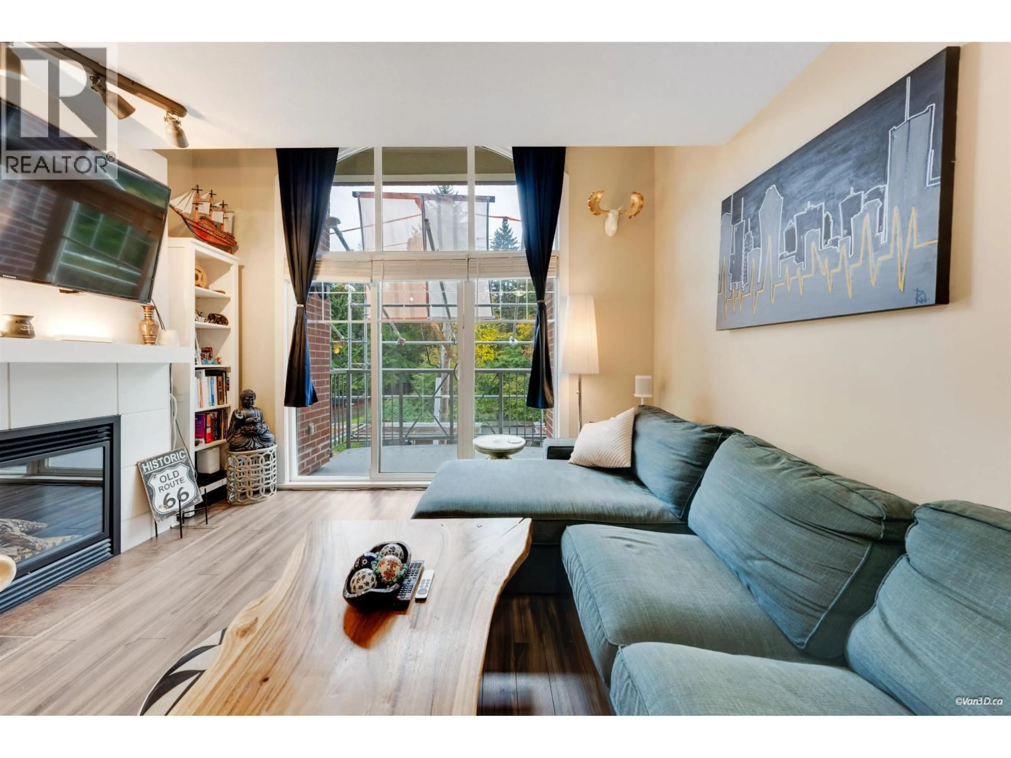 Living room with furniture, wood/laminate floor for 403 - 3250 ST JOHNS STREET, Port Moody British Columbia V3H0B1