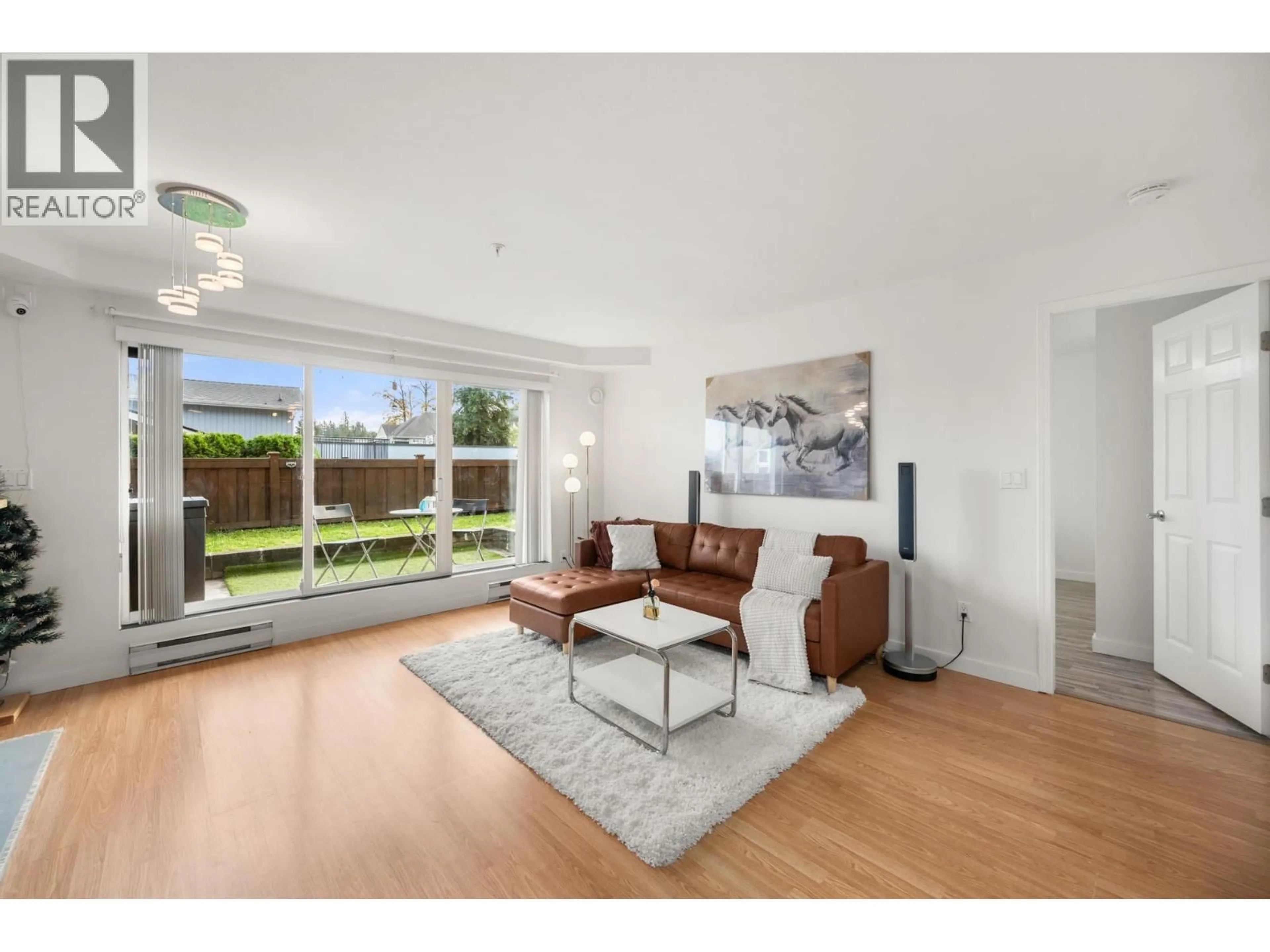 Living room with furniture, unknown for 106 - 1570 PRAIRIE AVENUE, Port Coquitlam British Columbia V3B1T4