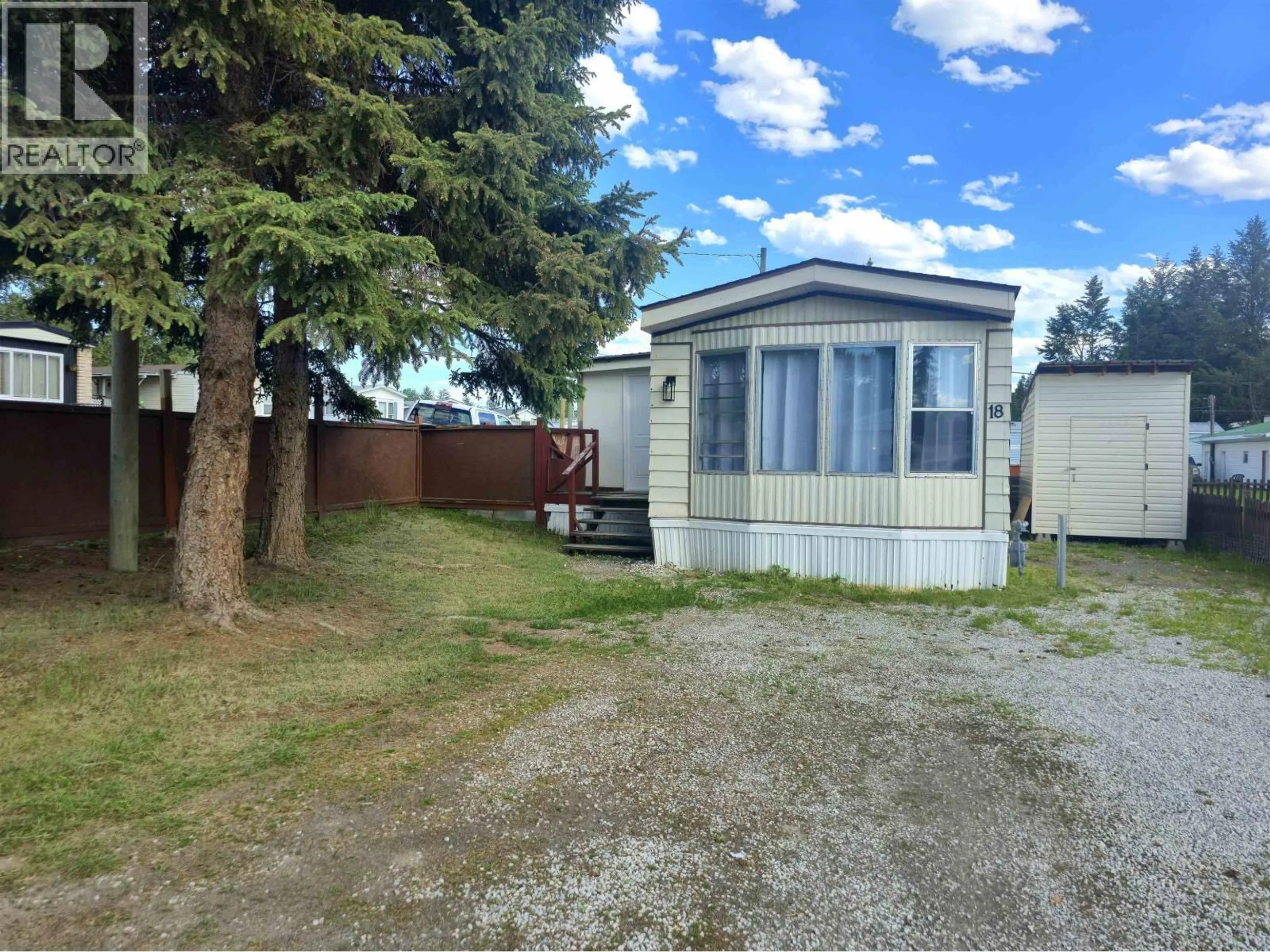A pic from outside/outdoor area/front of a property/back of a property/a pic from drone, street for 18 - 5378 PARK DRIVE, 103 Mile House British Columbia V0K2E1