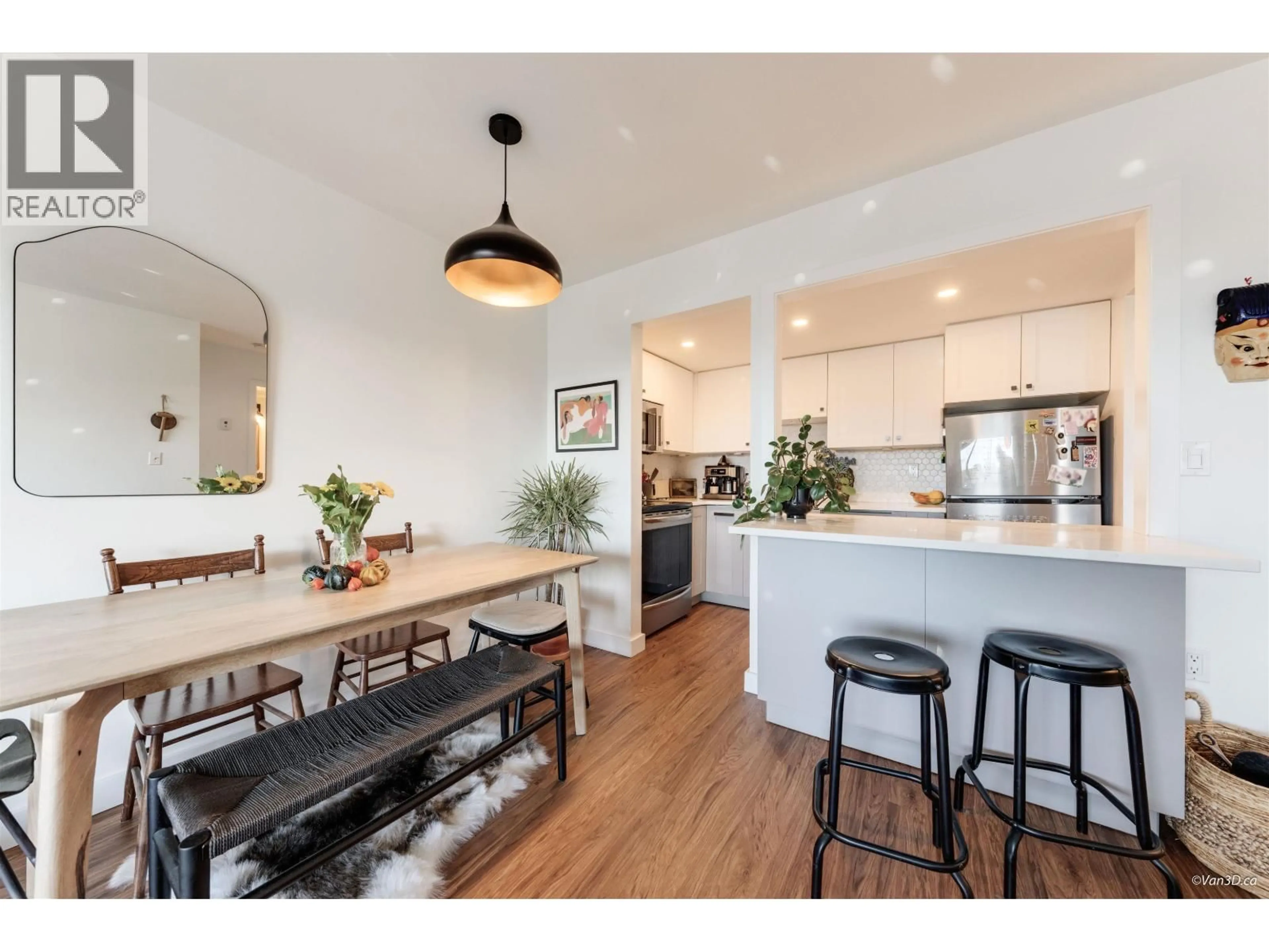 Open concept kitchen, wood/laminate floor for 408 - 2215 DUNDAS STREET, Vancouver British Columbia V5L1J9