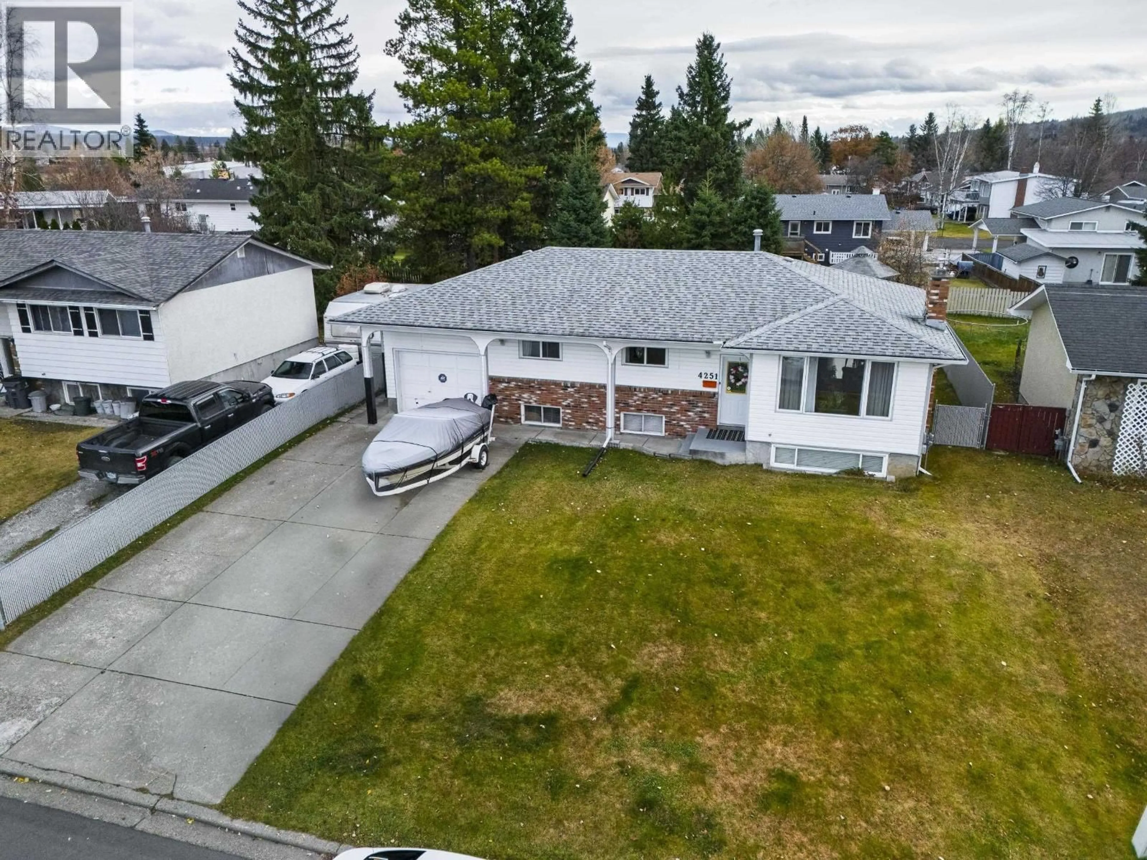 A pic from outside/outdoor area/front of a property/back of a property/a pic from drone, street for 4251 MERTON CRESCENT, Prince George British Columbia V2M5B7