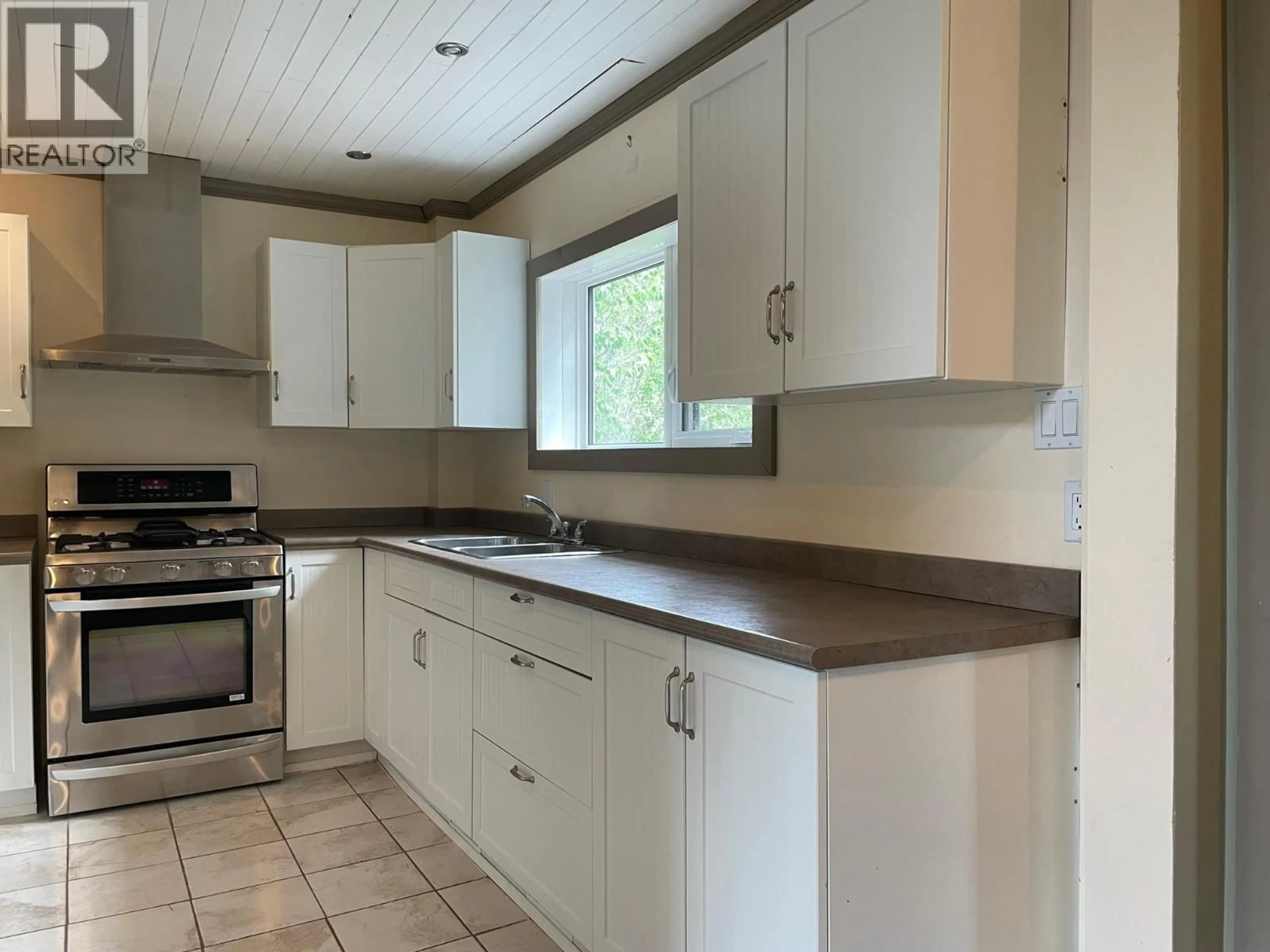 Standard kitchen, wood/laminate floor for 72 PIONEER WAY, Fort Nelson British Columbia V0C1R0