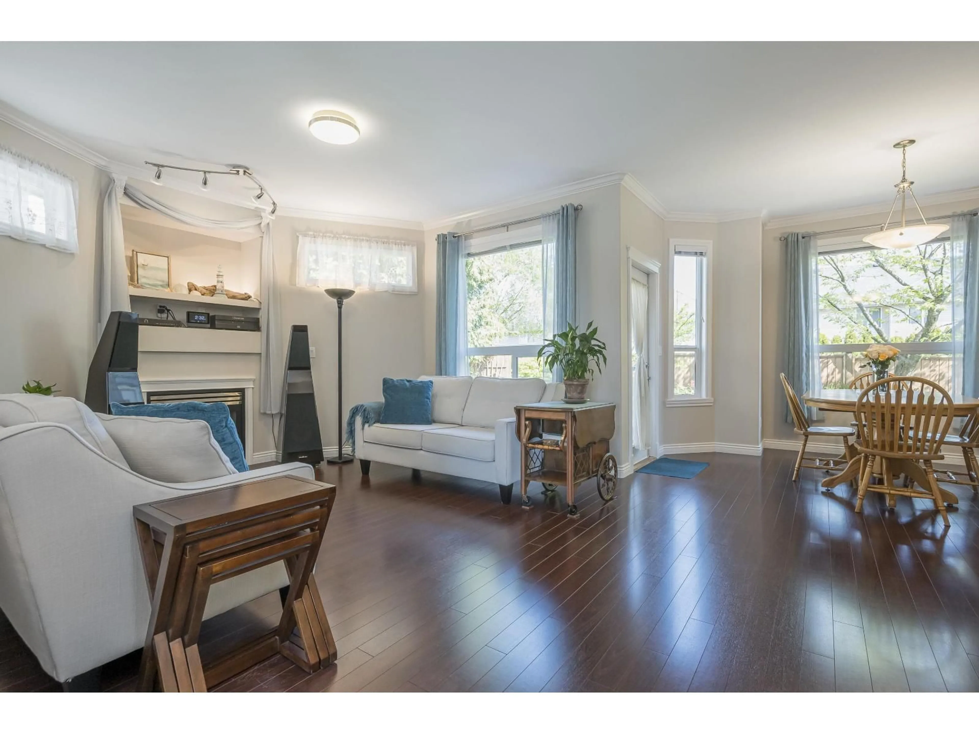 Living room with furniture, wood/laminate floor for 16477 59A AVE, Surrey British Columbia V3S6M6