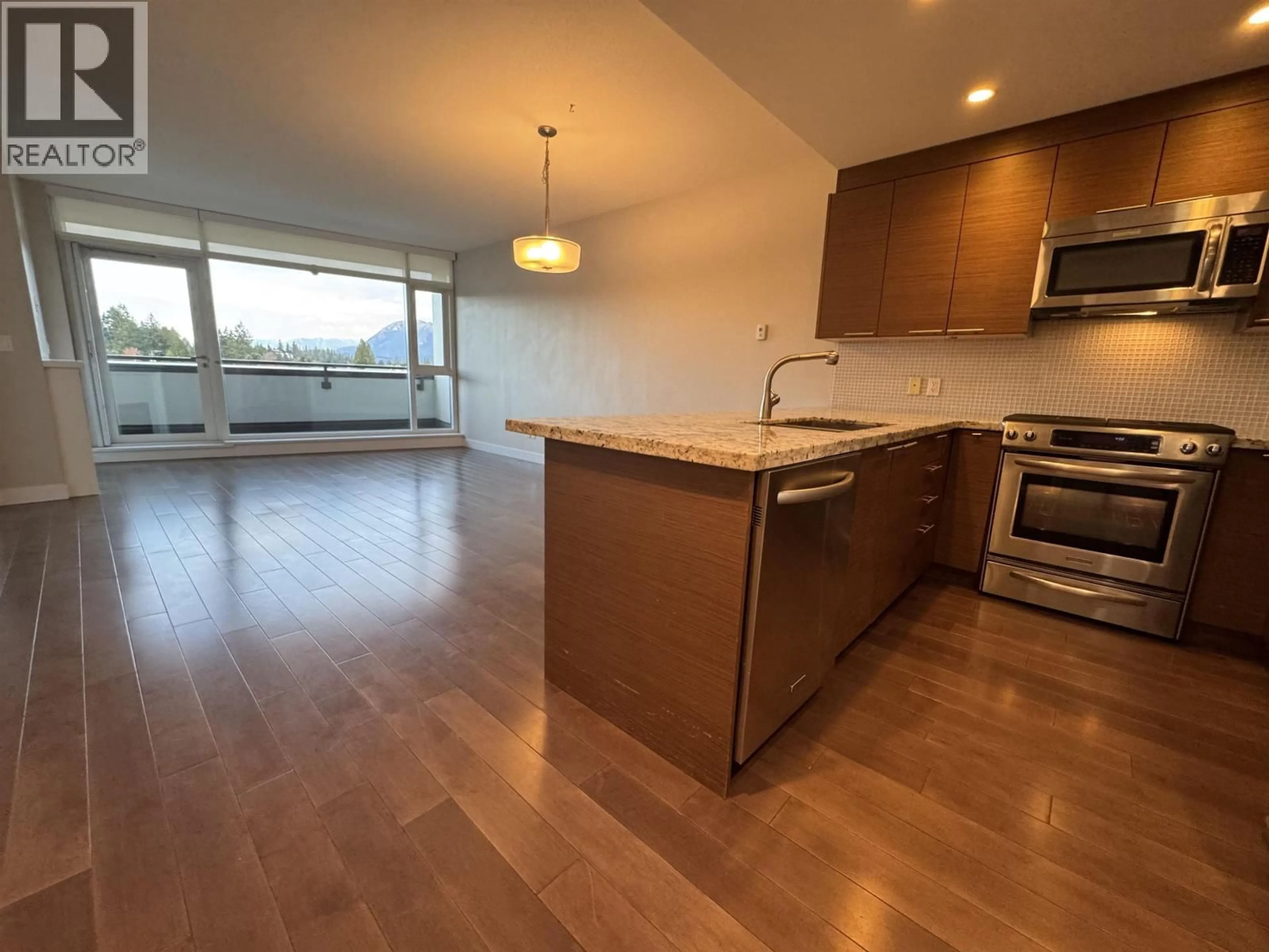 Open concept kitchen, wood/laminate floor for 507 - 5725 TEREDO STREET, Sechelt British Columbia V7Z0J2