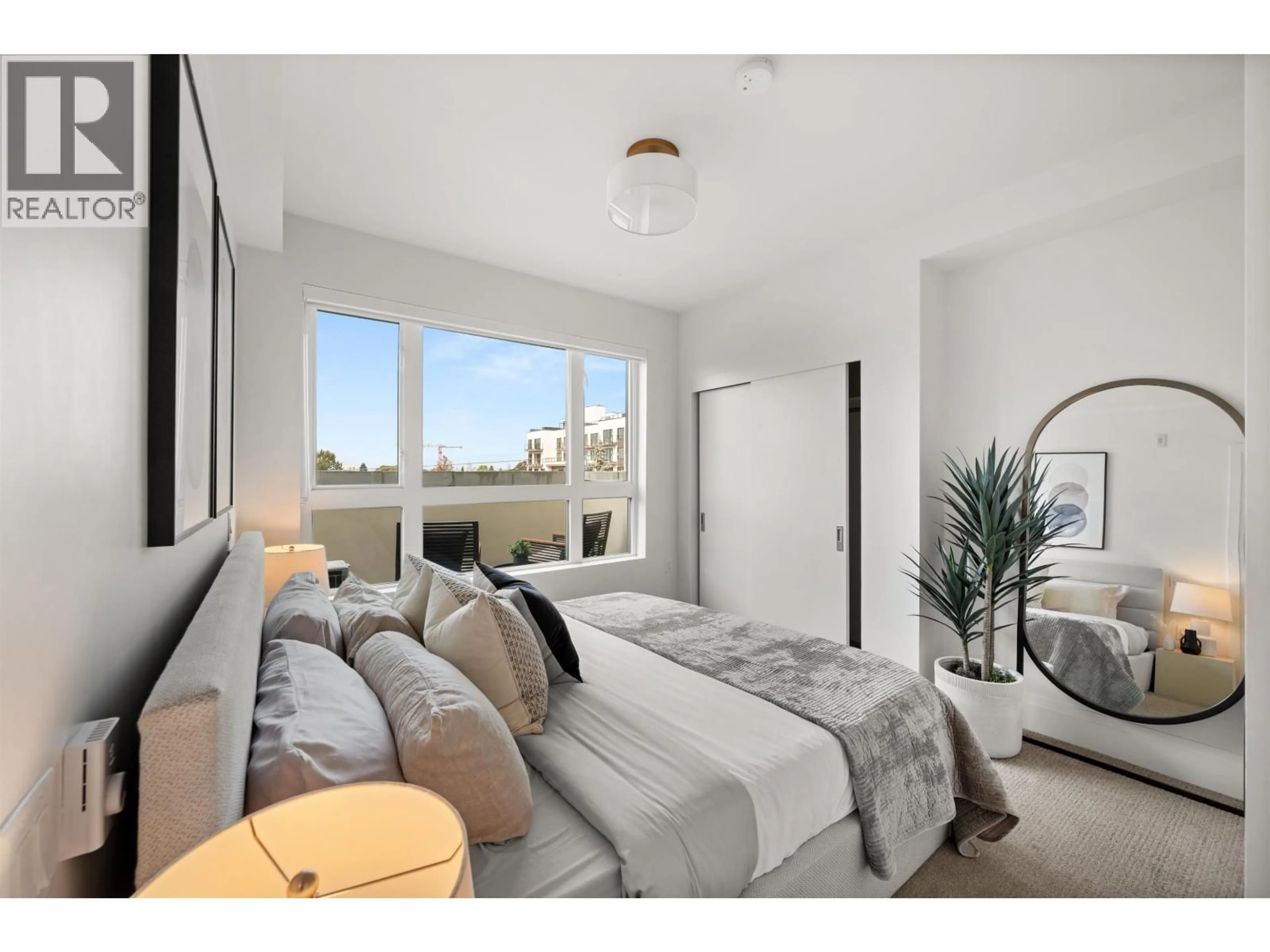 Bedroom with bed, unknown for 406 - 2550 GARDEN DRIVE, Vancouver British Columbia V5N4X6