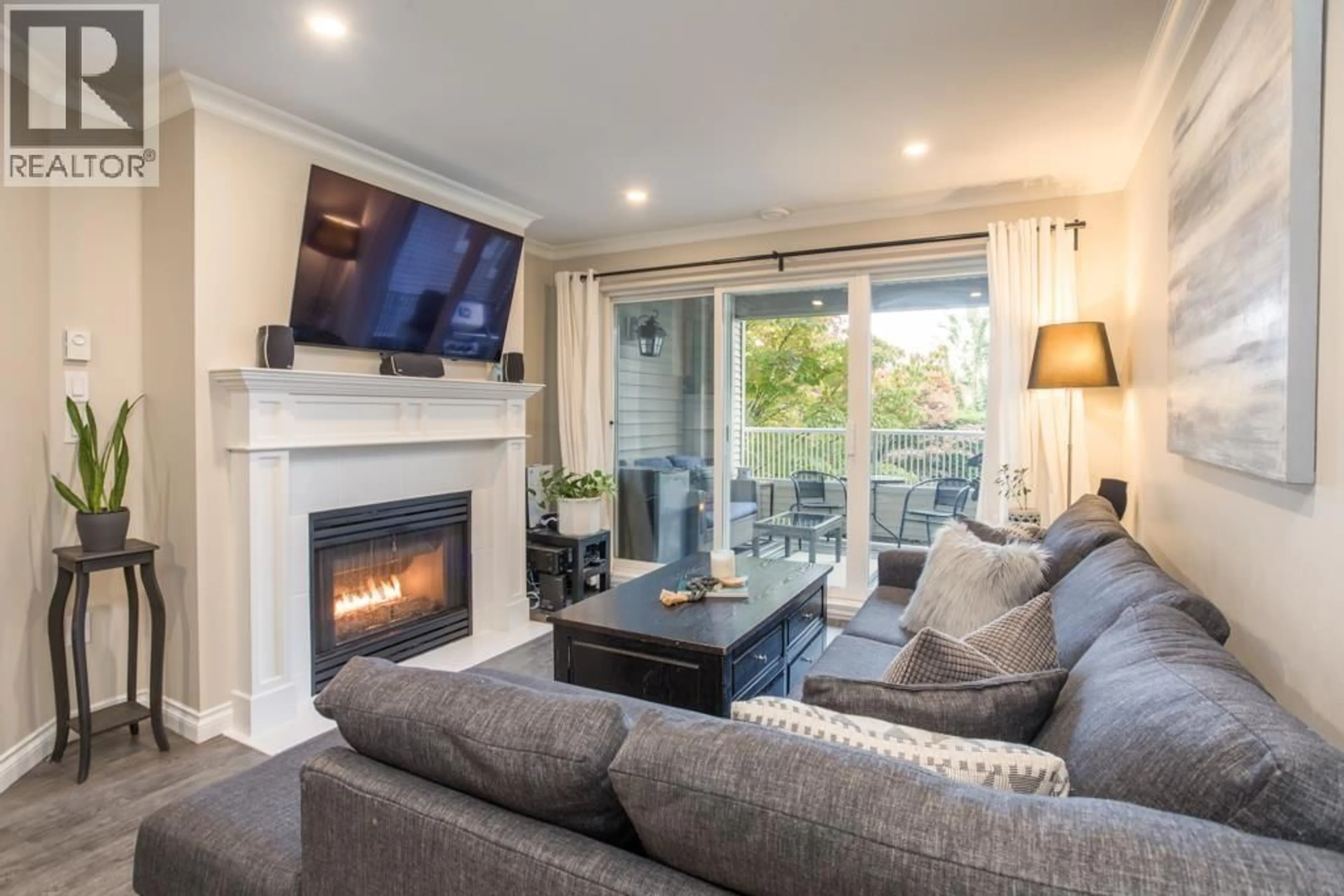 Living room with furniture, wood/laminate floor for 212 - 4770 52A STREET, Delta British Columbia V4K5B5