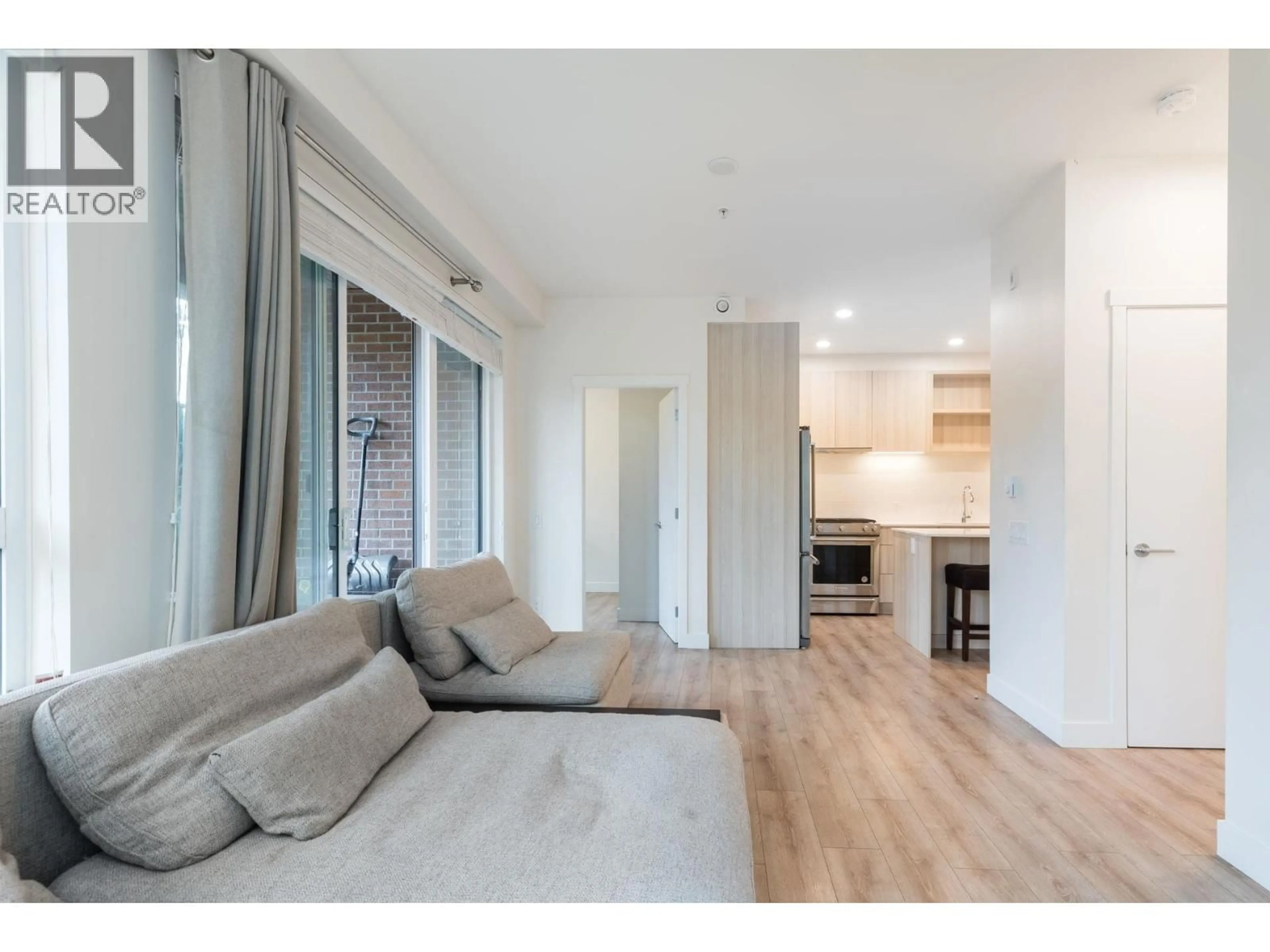 Living room with furniture, wood/laminate floor for 121 - 721 ANSKAR COURT, Coquitlam British Columbia V3J0L4