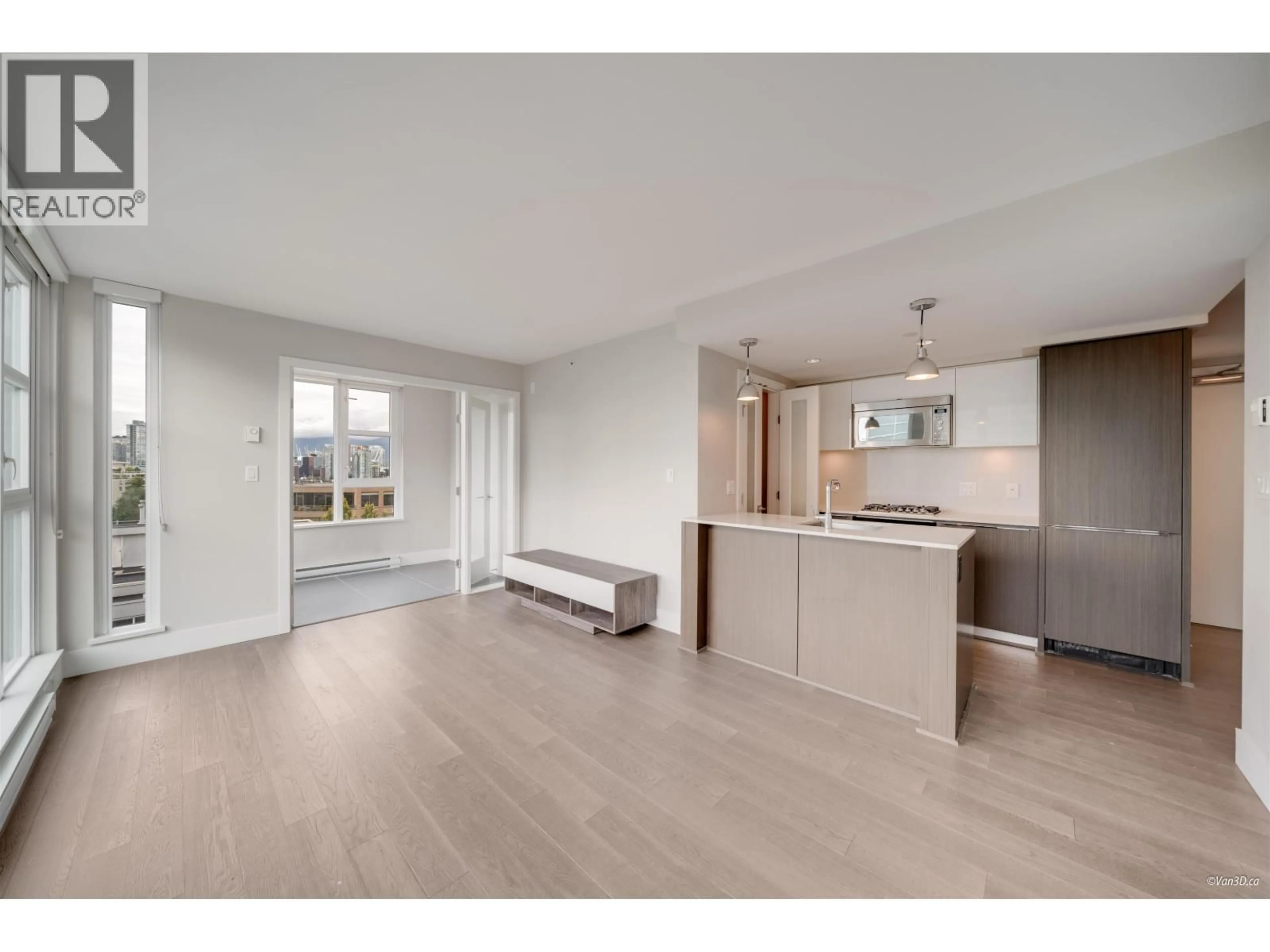 Open concept kitchen, wood/laminate floor for 801 - 538 7TH AVENUE, Vancouver British Columbia V5Z1B3