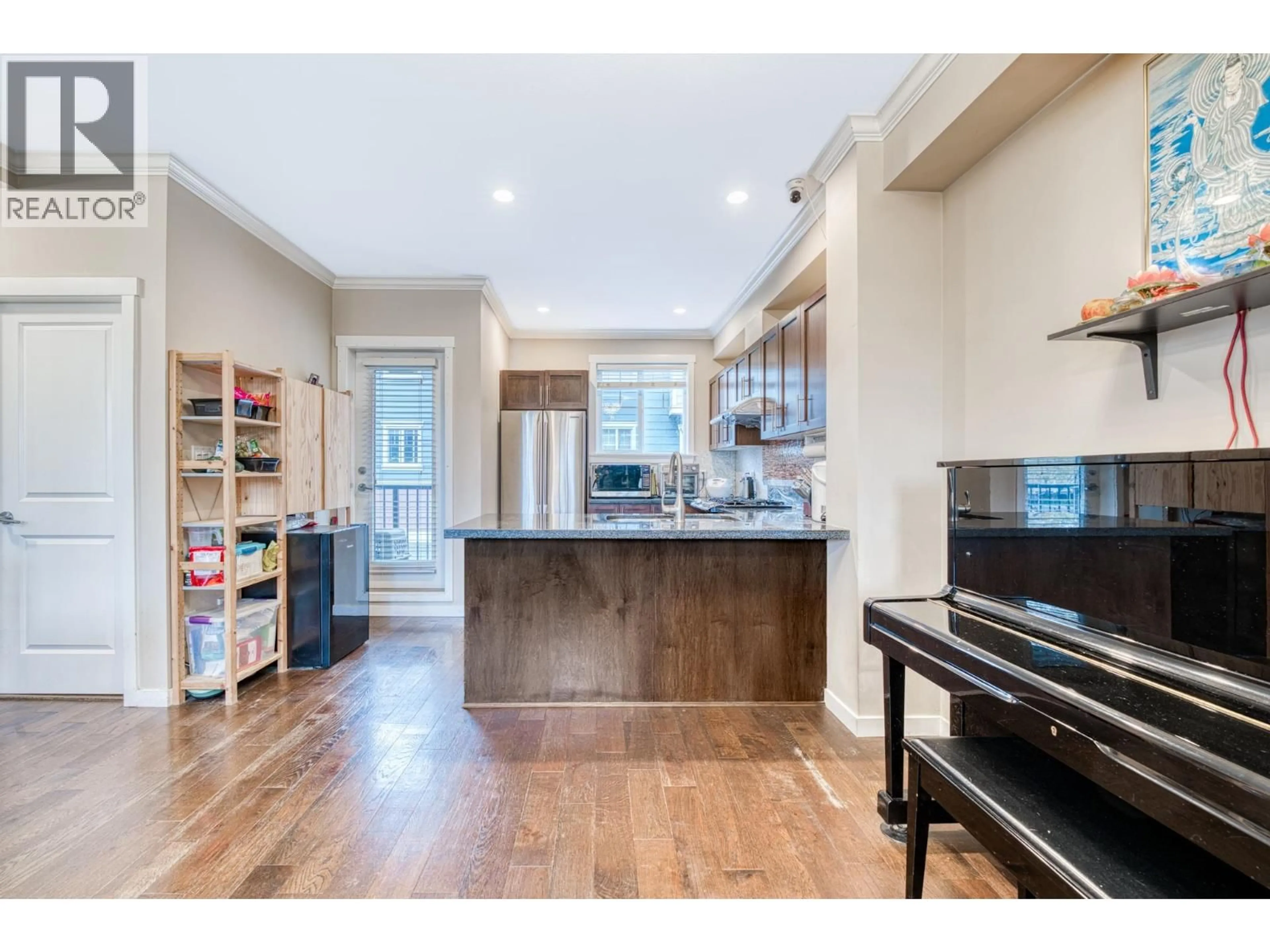 Open concept kitchen, wood/laminate floor for 4 - 9580 ALBERTA ROAD, Richmond British Columbia V6Y1T6