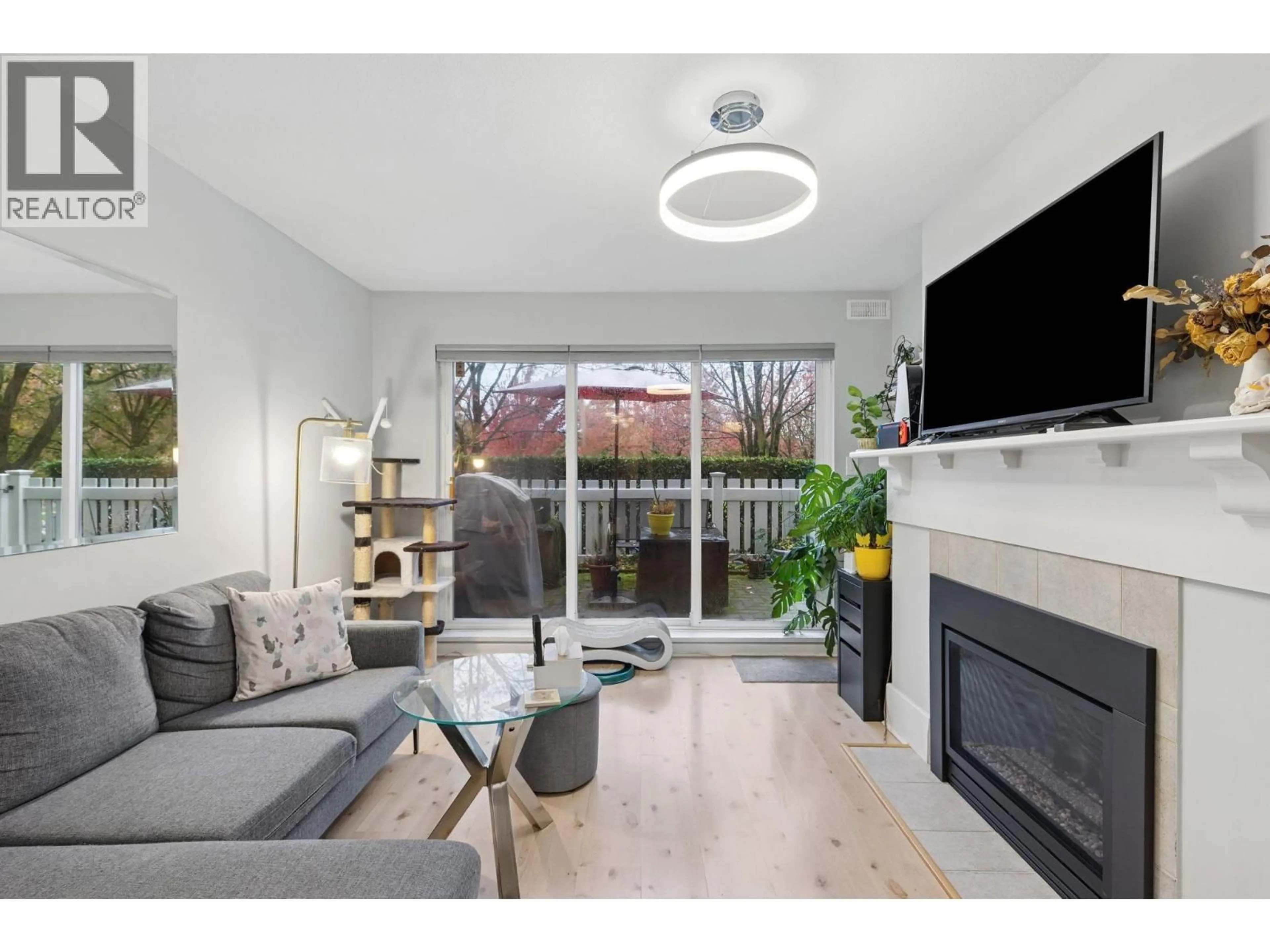 Living room with furniture, wood/laminate floor for 110 - 5900 DOVER CRESCENT, Richmond British Columbia V7C5R4