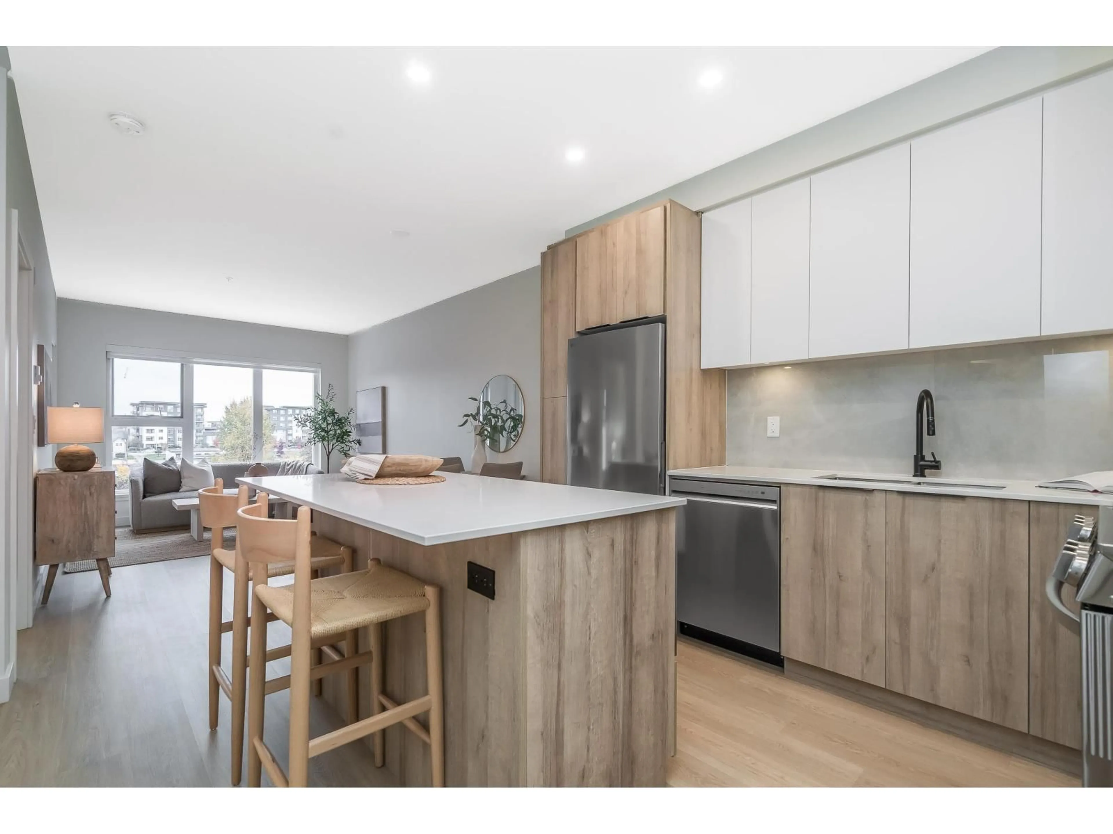 Open concept kitchen, wood/laminate floor for A411 - 7980 206A, Langley British Columbia V2Y3Z8