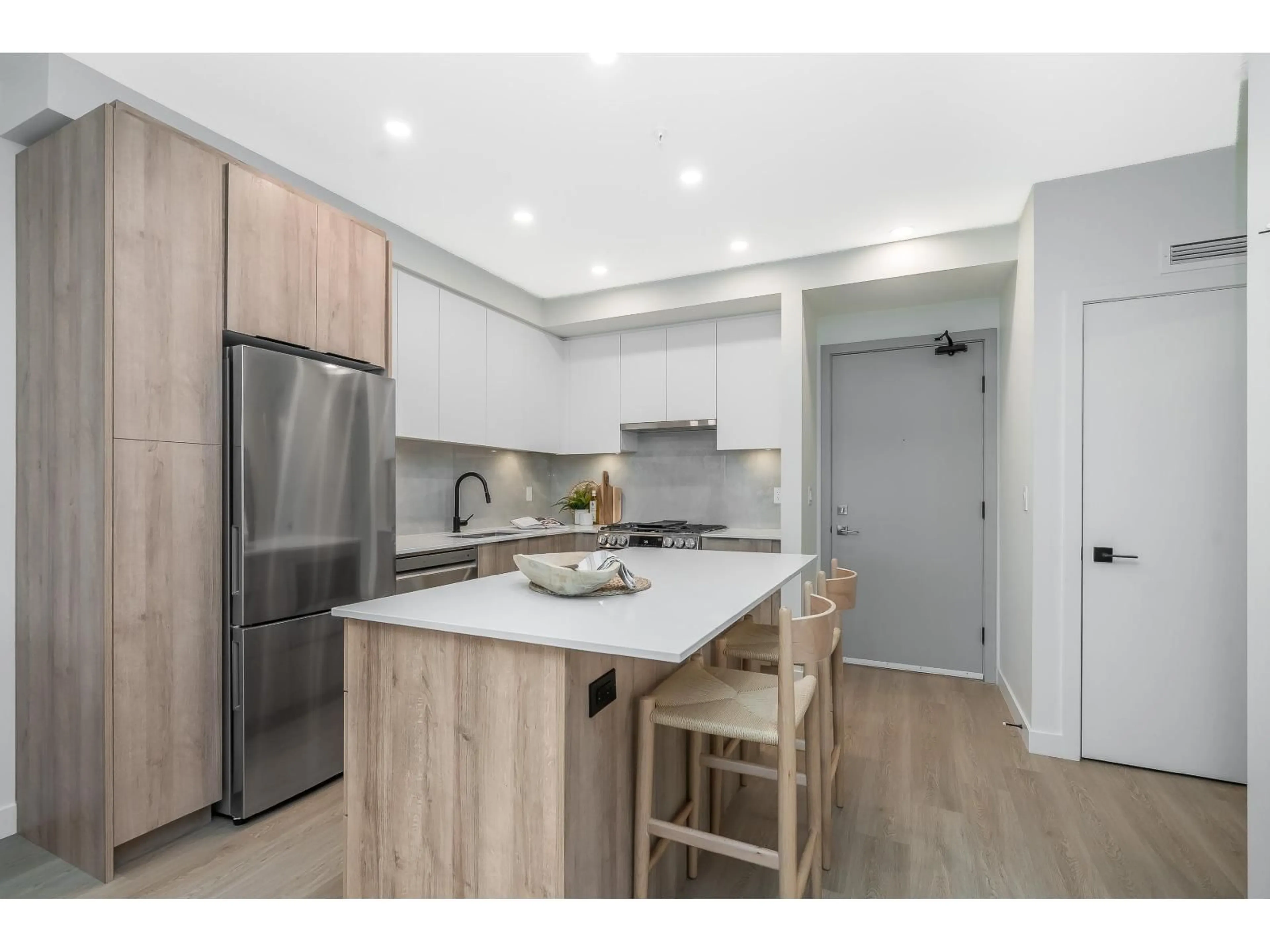 Open concept kitchen, wood/laminate floor for A411 - 7980 206A, Langley British Columbia V2Y3Z8