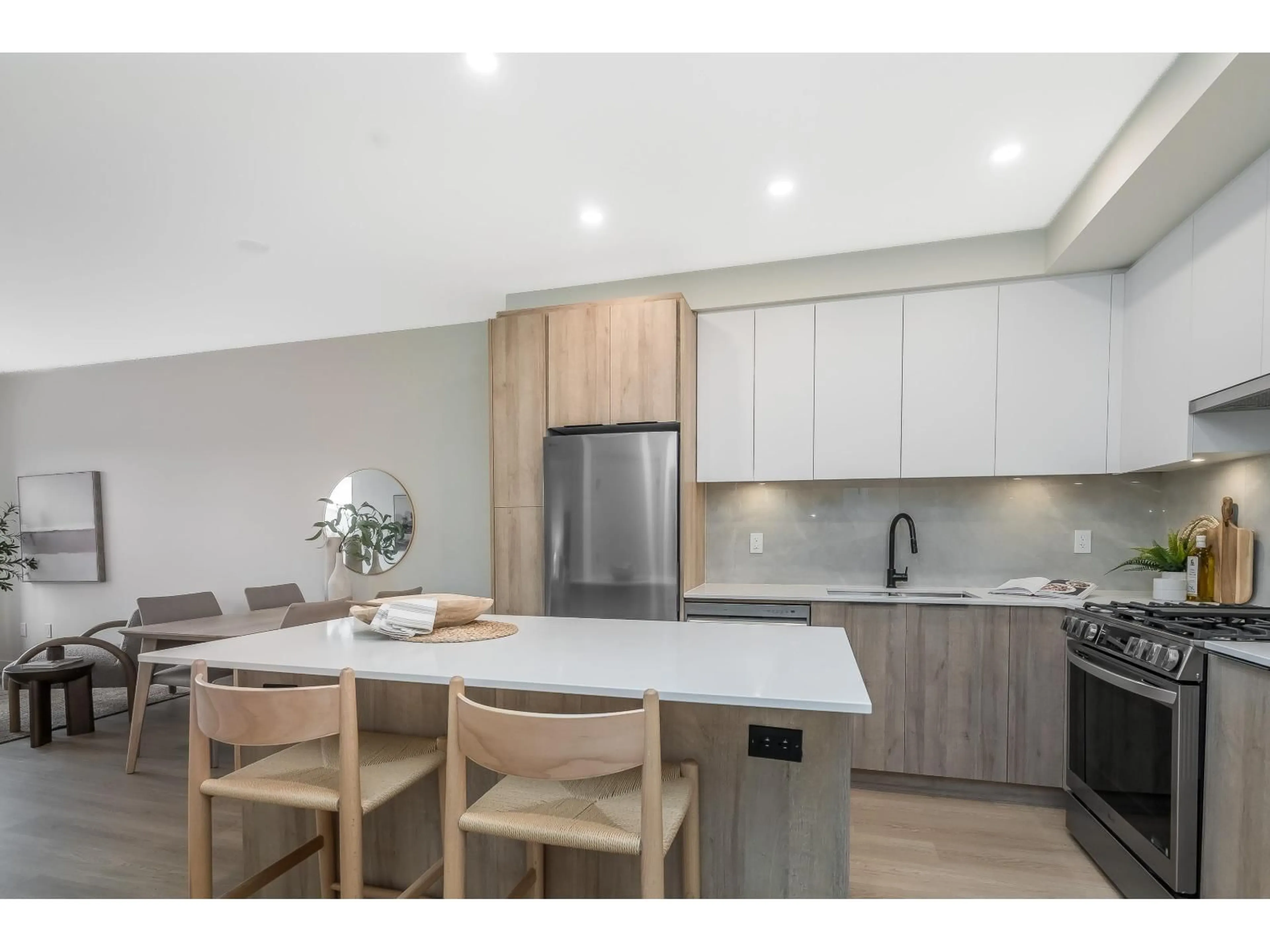 Open concept kitchen, wood/laminate floor for A411 - 7980 206A, Langley British Columbia V2Y3Z8