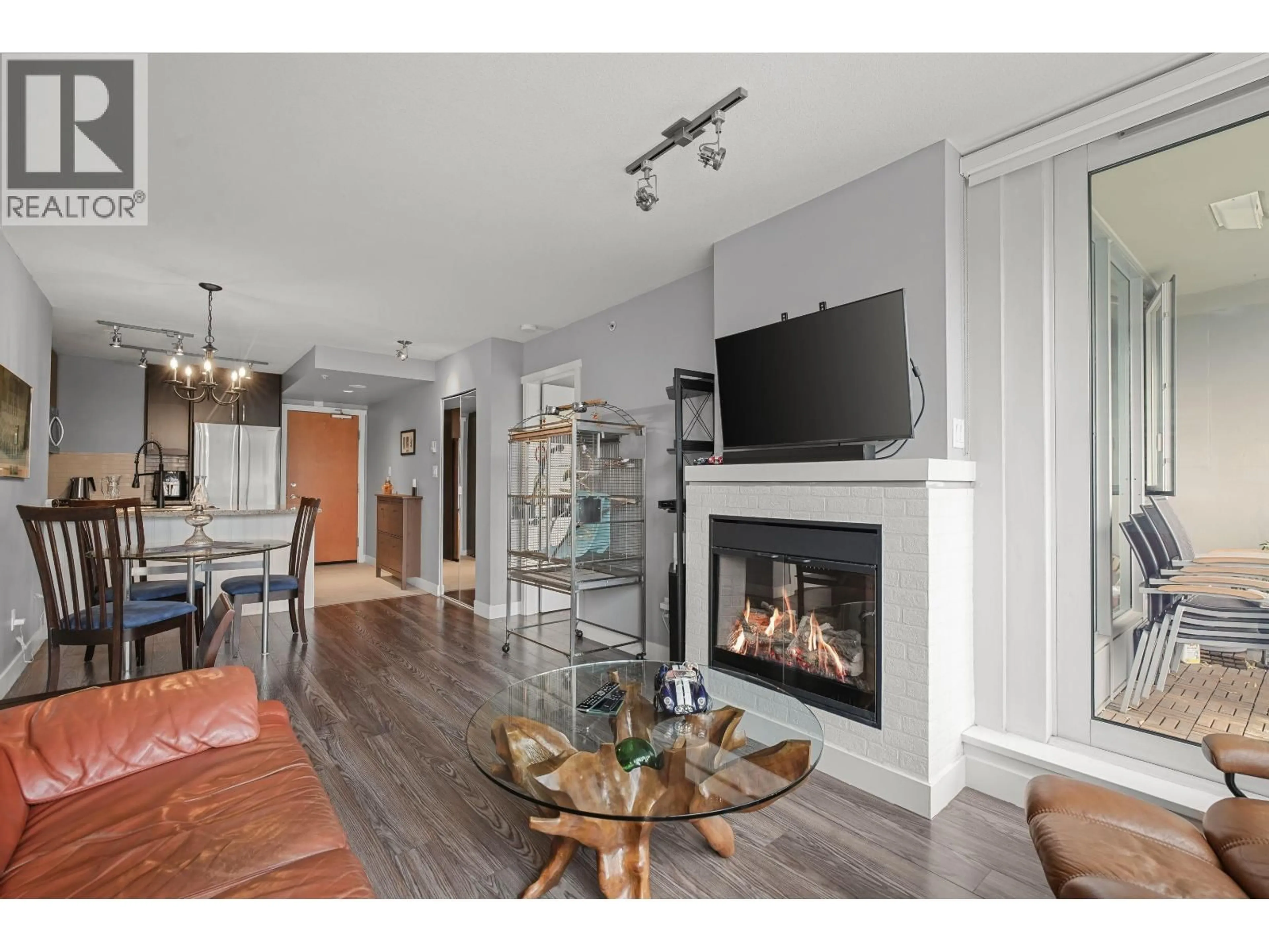 Living room with furniture, wood/laminate floor for 1602 - 651 NOOTKA WAY, Port Moody British Columbia V3H0A1