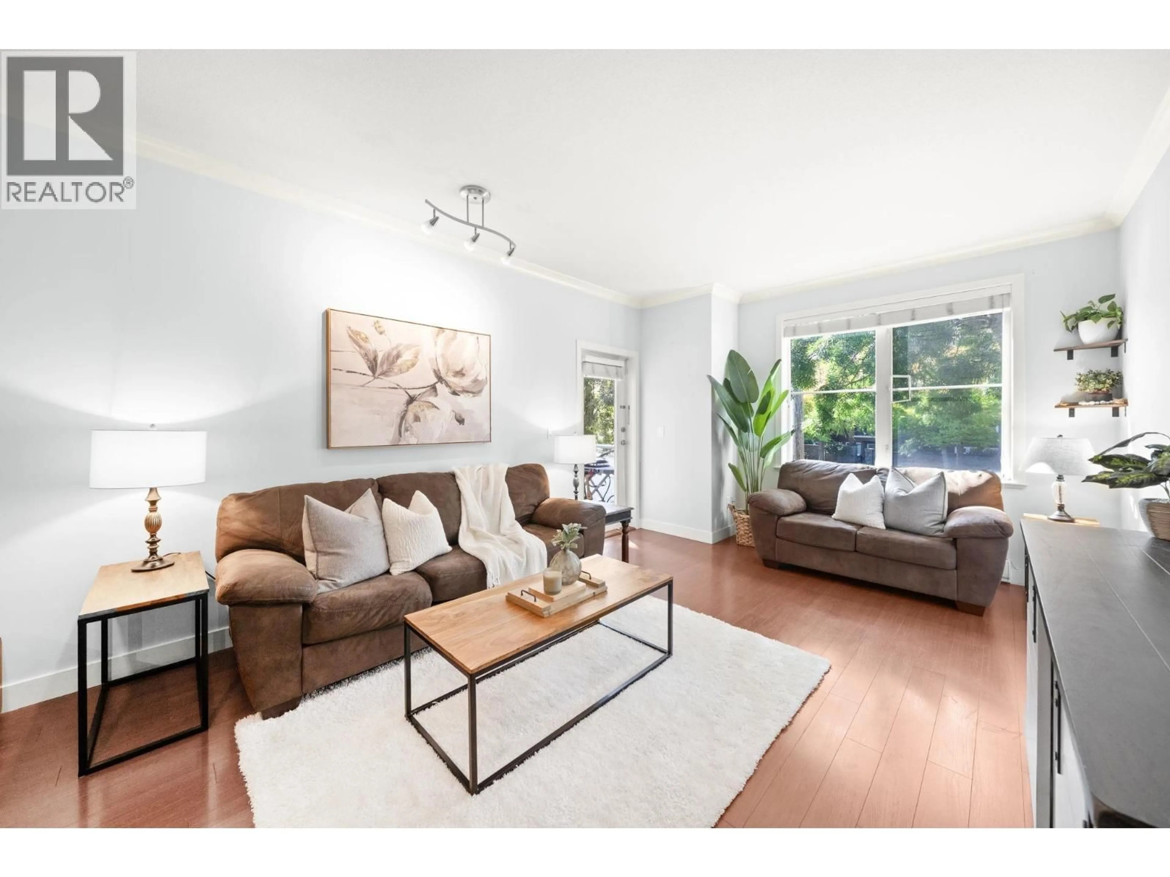 Living room with furniture, wood/laminate floor for 206 - 1375 VIEW CRESCENT, Delta British Columbia V4L0A3